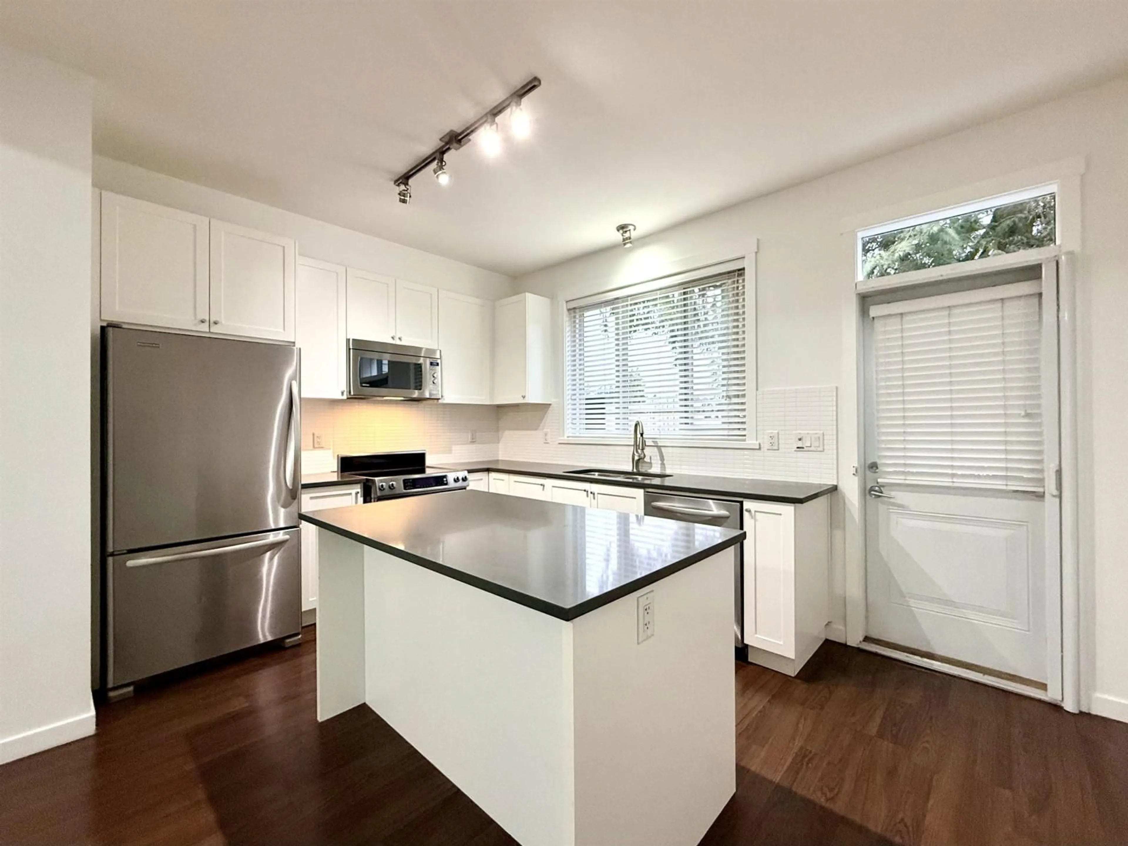 Open concept kitchen, wood/laminate floor for 15 - 2487 156 STREET, Surrey British Columbia V4P1C7