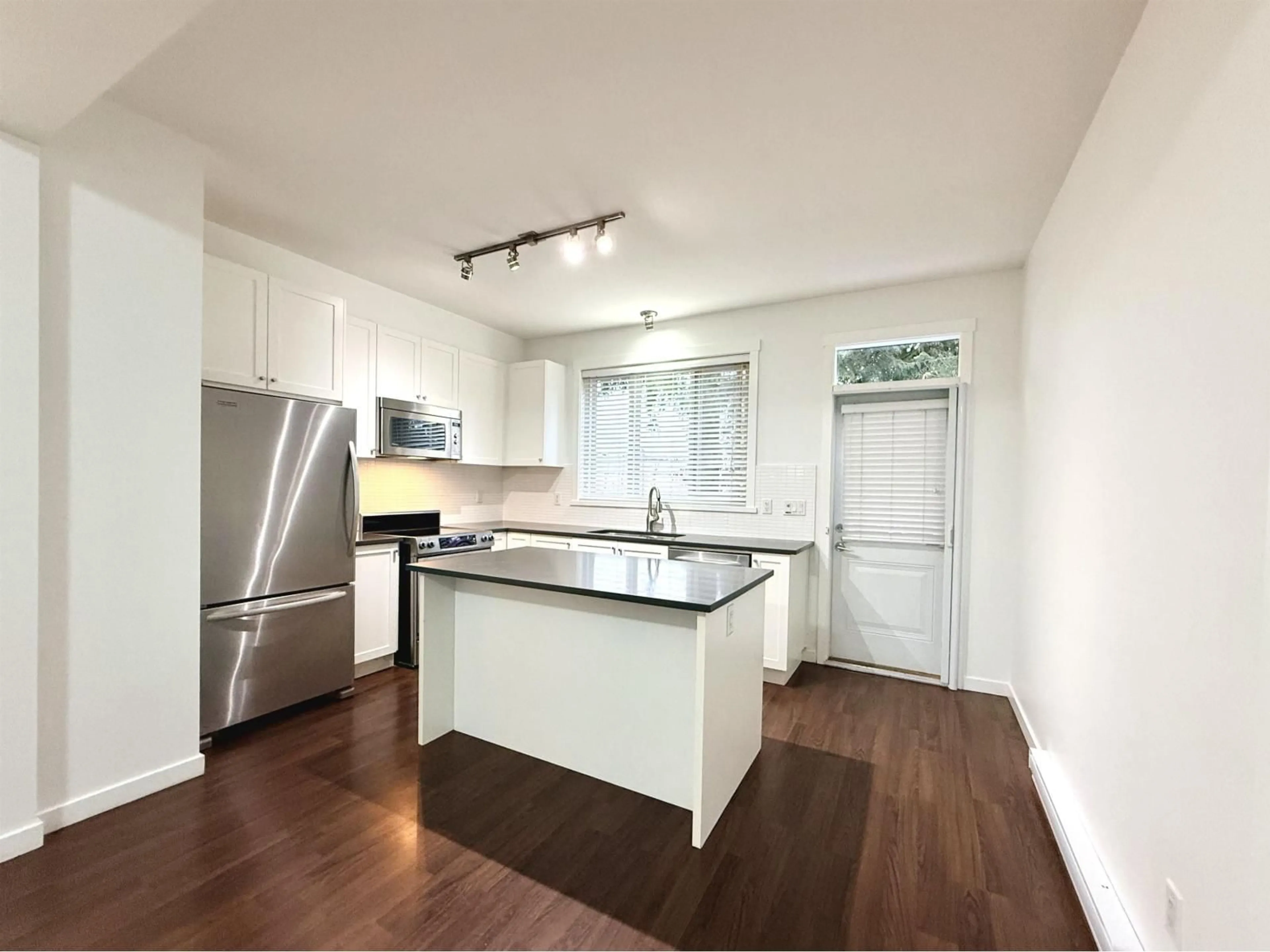 Open concept kitchen, wood/laminate floor for 15 - 2487 156 STREET, Surrey British Columbia V4P1C7