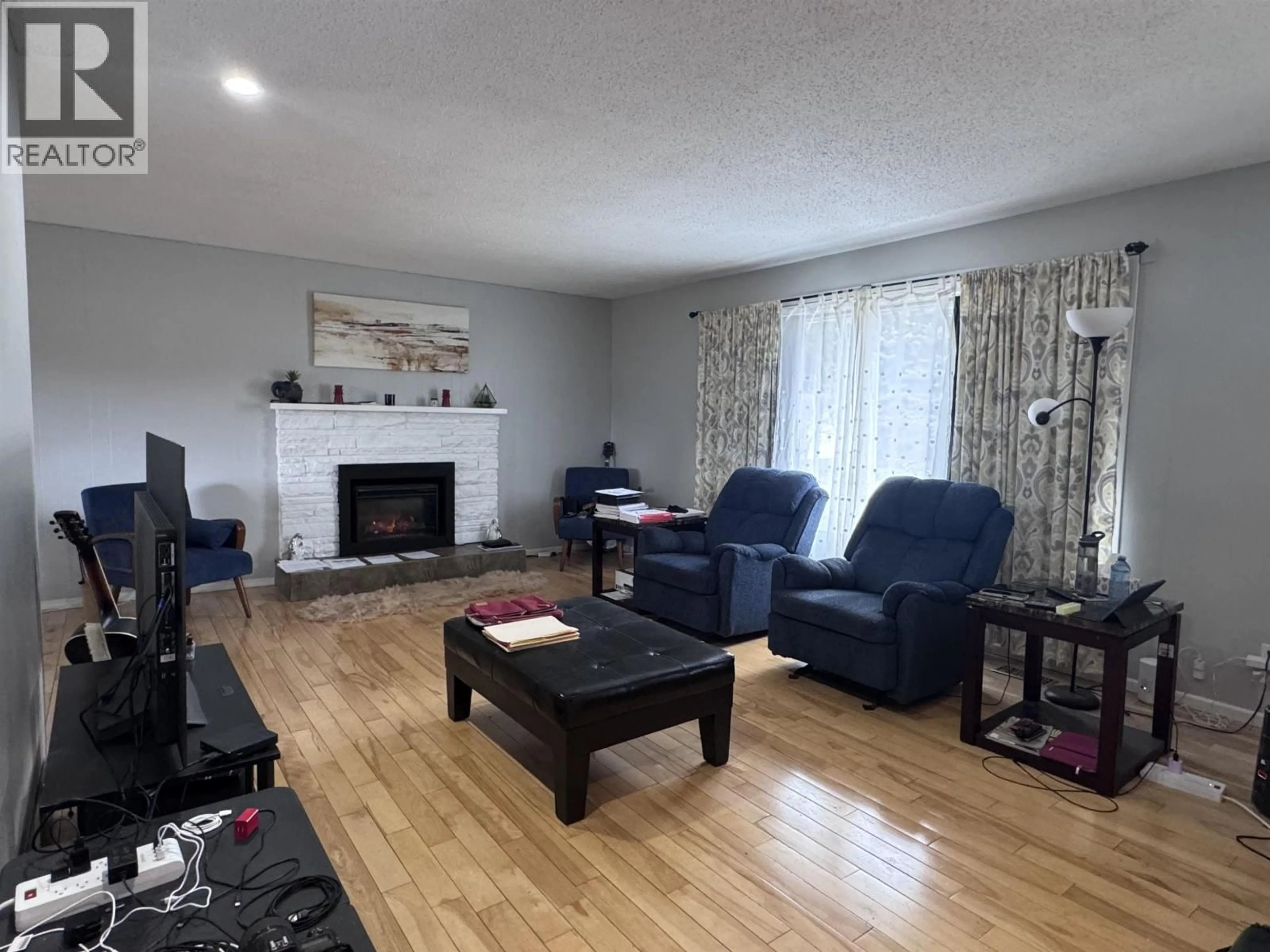 Living room with furniture, wood/laminate floor for 4919 SCOTT AVENUE, Terrace British Columbia V8G2B7