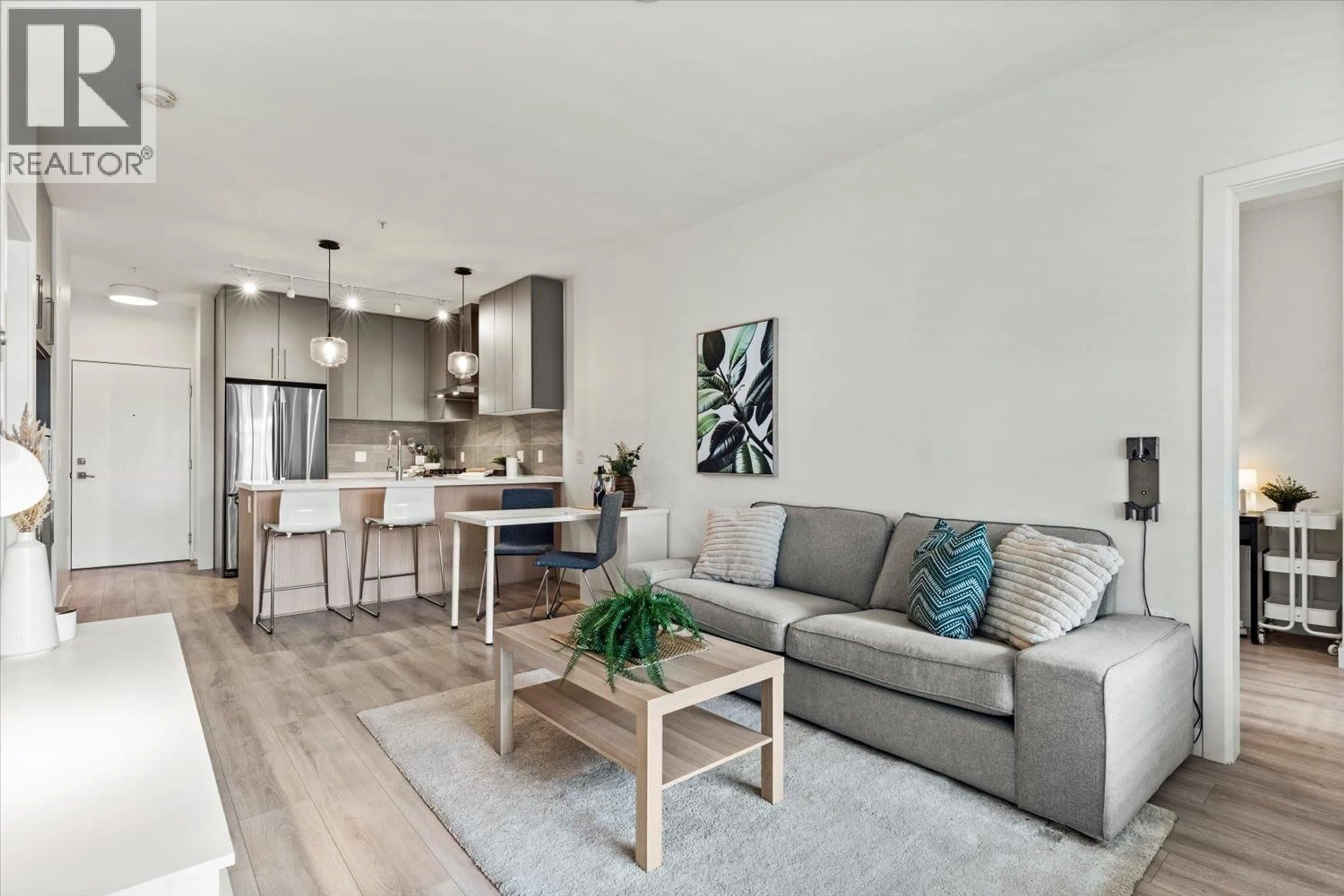 Living room with furniture, wood/laminate floor for 206 - 603 REGAN AVENUE, Coquitlam British Columbia V3J0K2