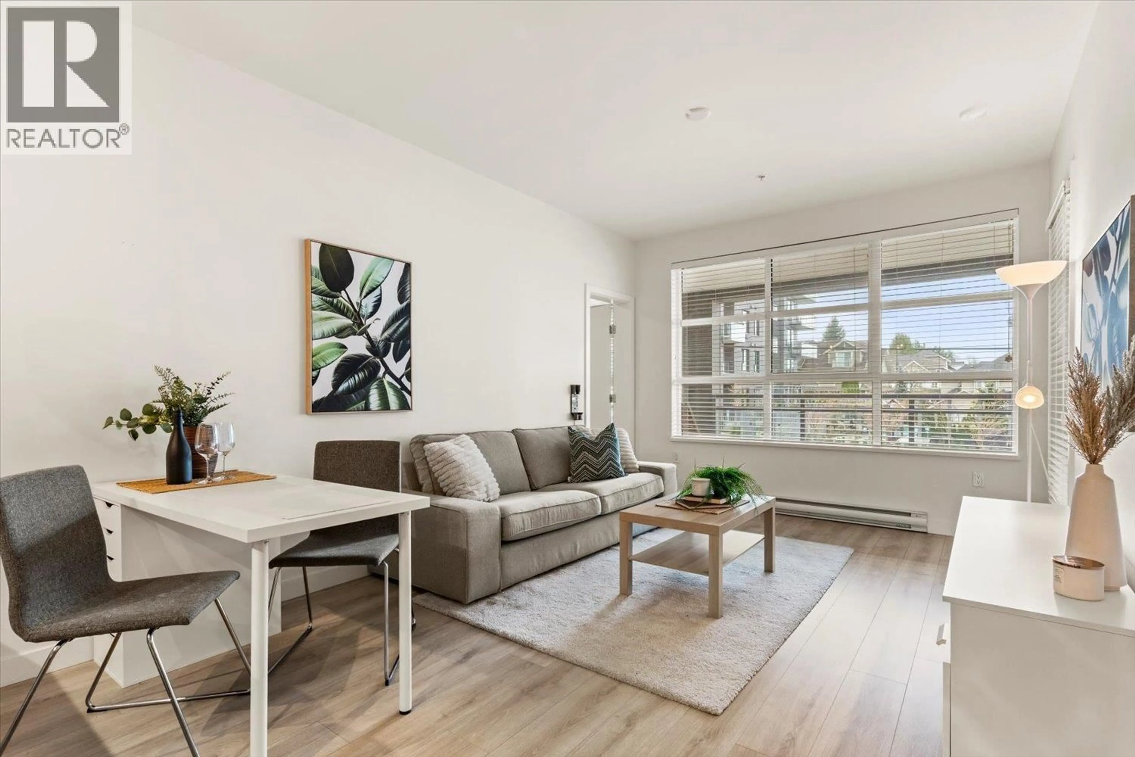 Living room with furniture, wood/laminate floor for 206 - 603 REGAN AVENUE, Coquitlam British Columbia V3J0K2