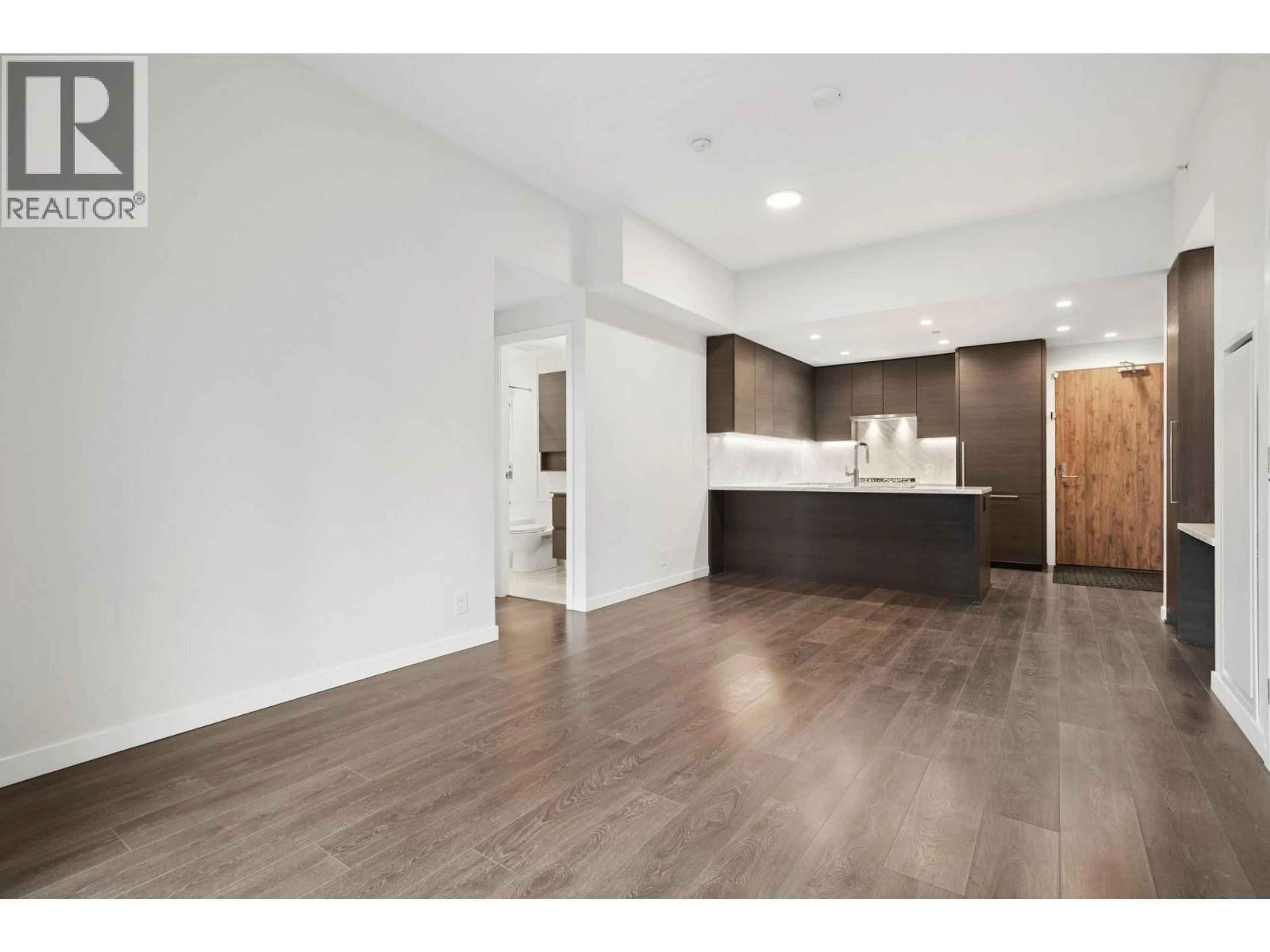 Open concept kitchen, wood/laminate floor for 103 - 308 MORRISSEY ROAD, Port Moody British Columbia V3H0M2