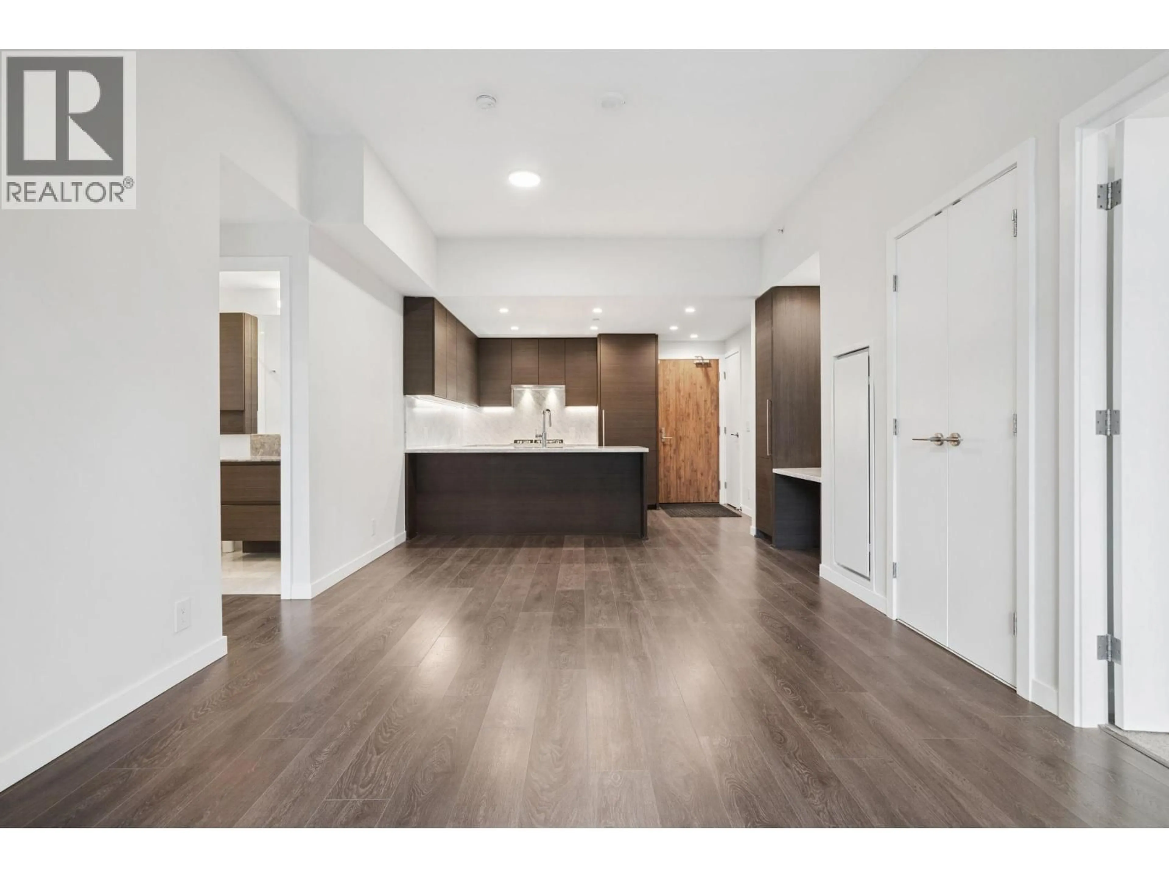 Open concept kitchen, wood/laminate floor for 103 - 308 MORRISSEY ROAD, Port Moody British Columbia V3H0M2
