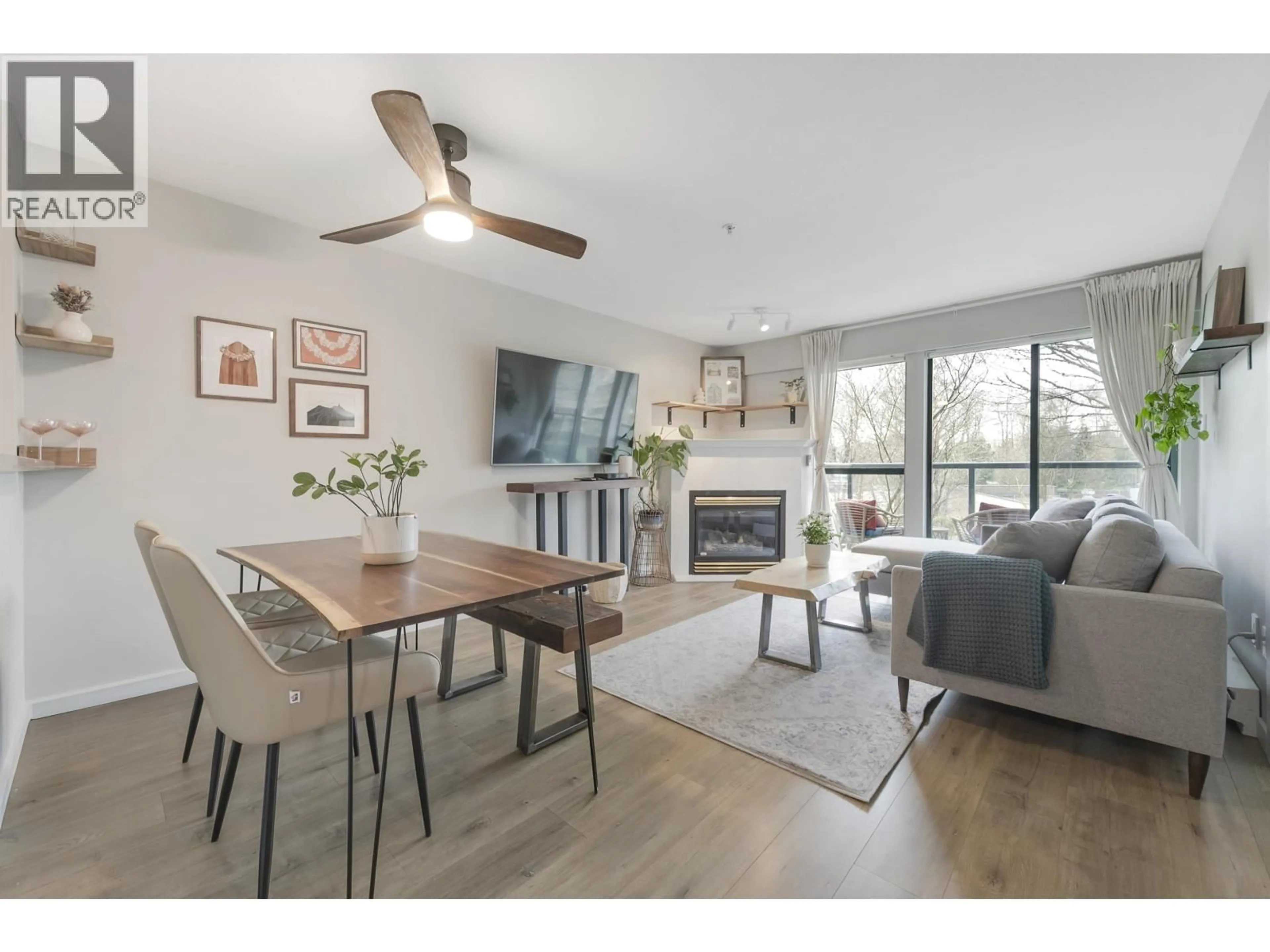 Living room with furniture, wood/laminate floor for 311 - 225 NEWPORT DRIVE, Port Moody British Columbia V3H5C7