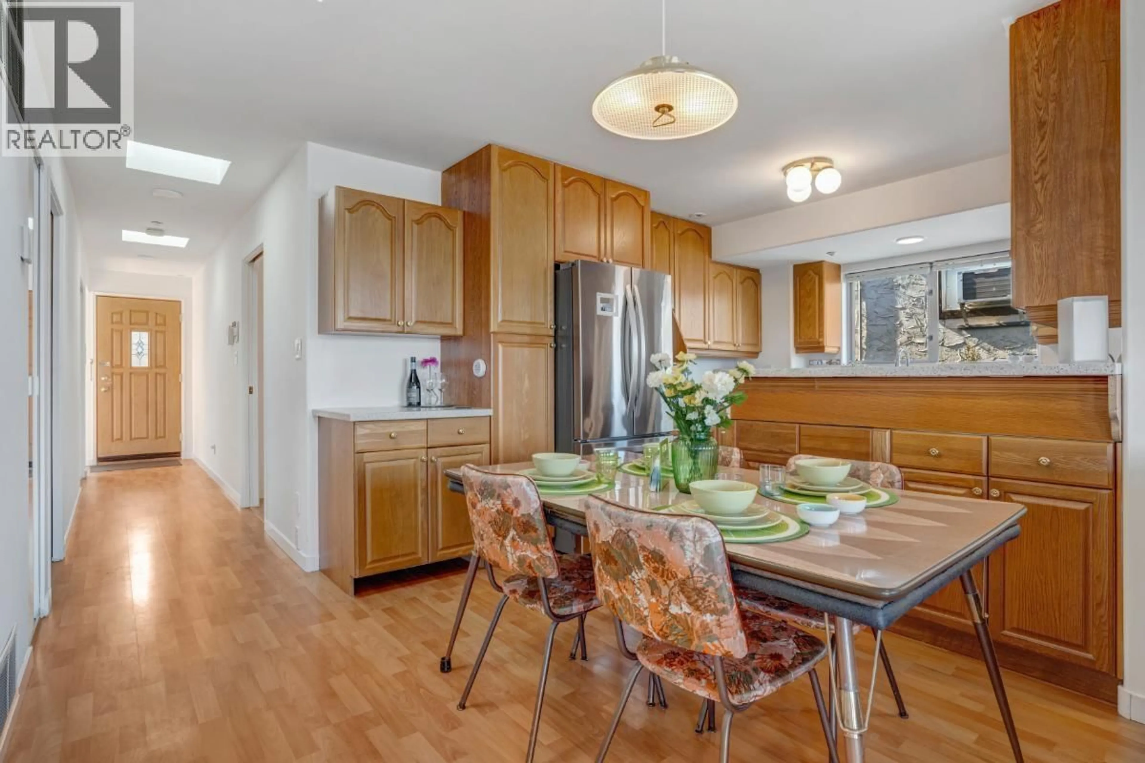 Open concept kitchen, wood/laminate floor for 2856 KING EDWARD AVENUE, Vancouver British Columbia V6L1T9