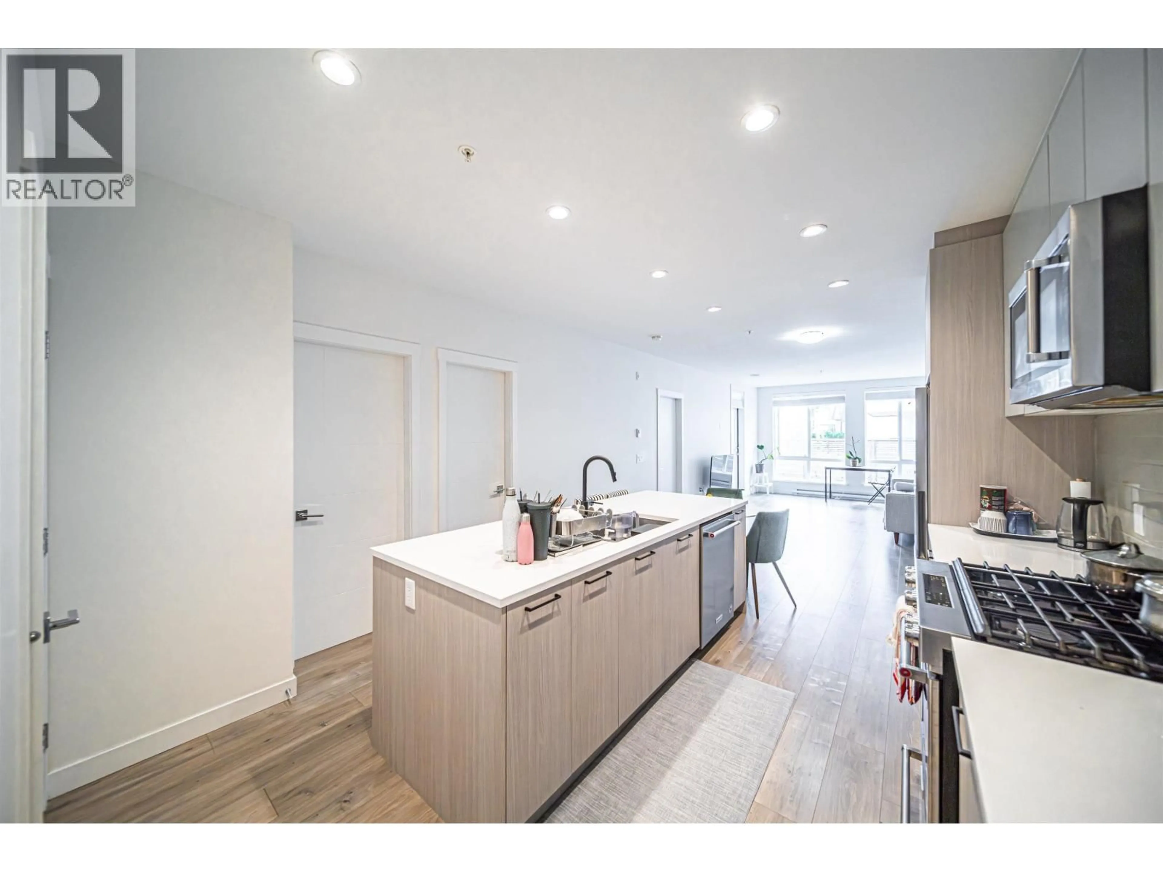 Open concept kitchen, unknown for 203 - 707 COMO LAKE AVENUE, Coquitlam British Columbia V3J0J5