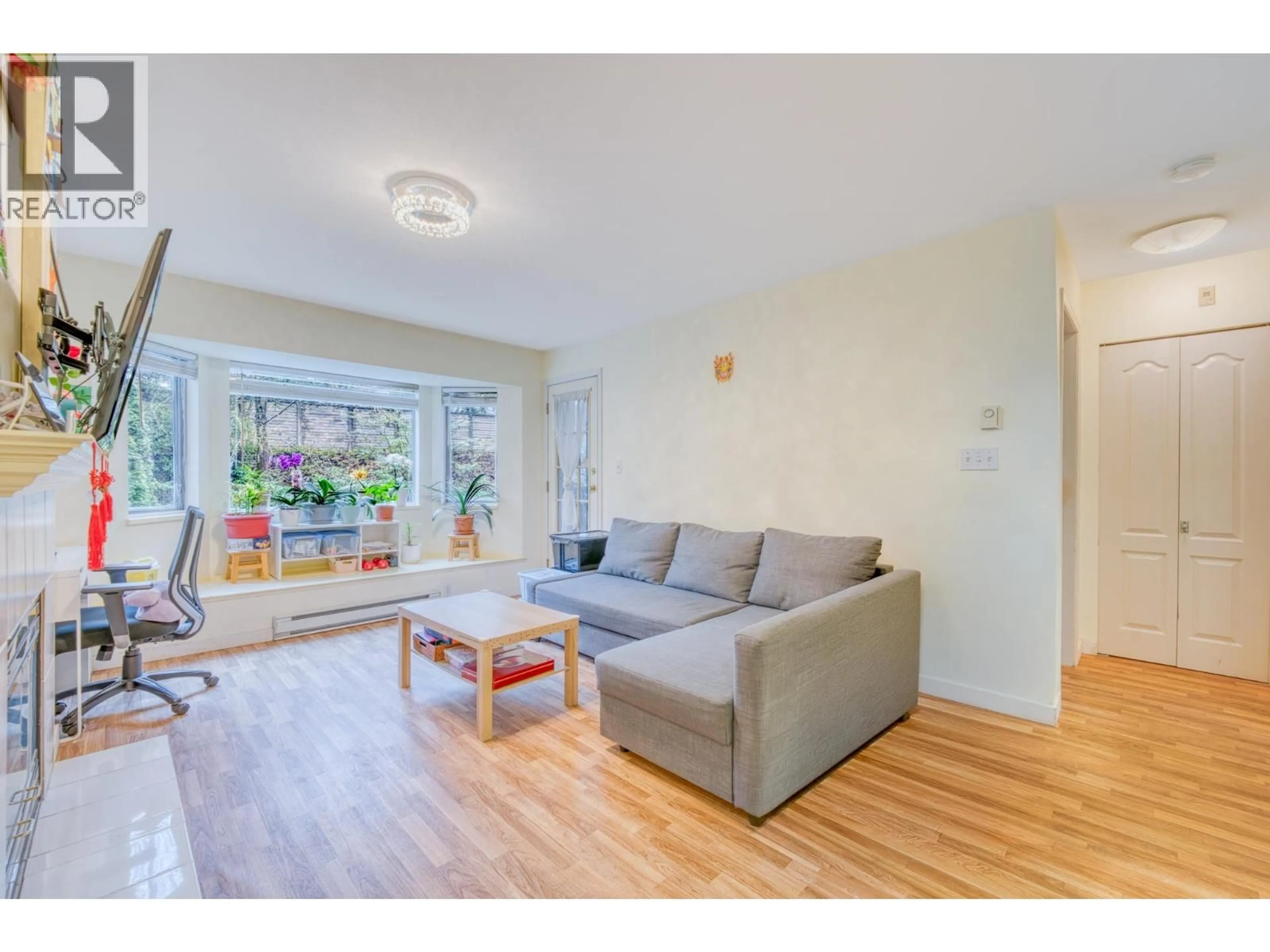 Living room with furniture, wood/laminate floor for 207 - 3738 NORFOLK STREET, Burnaby British Columbia V5G4V4