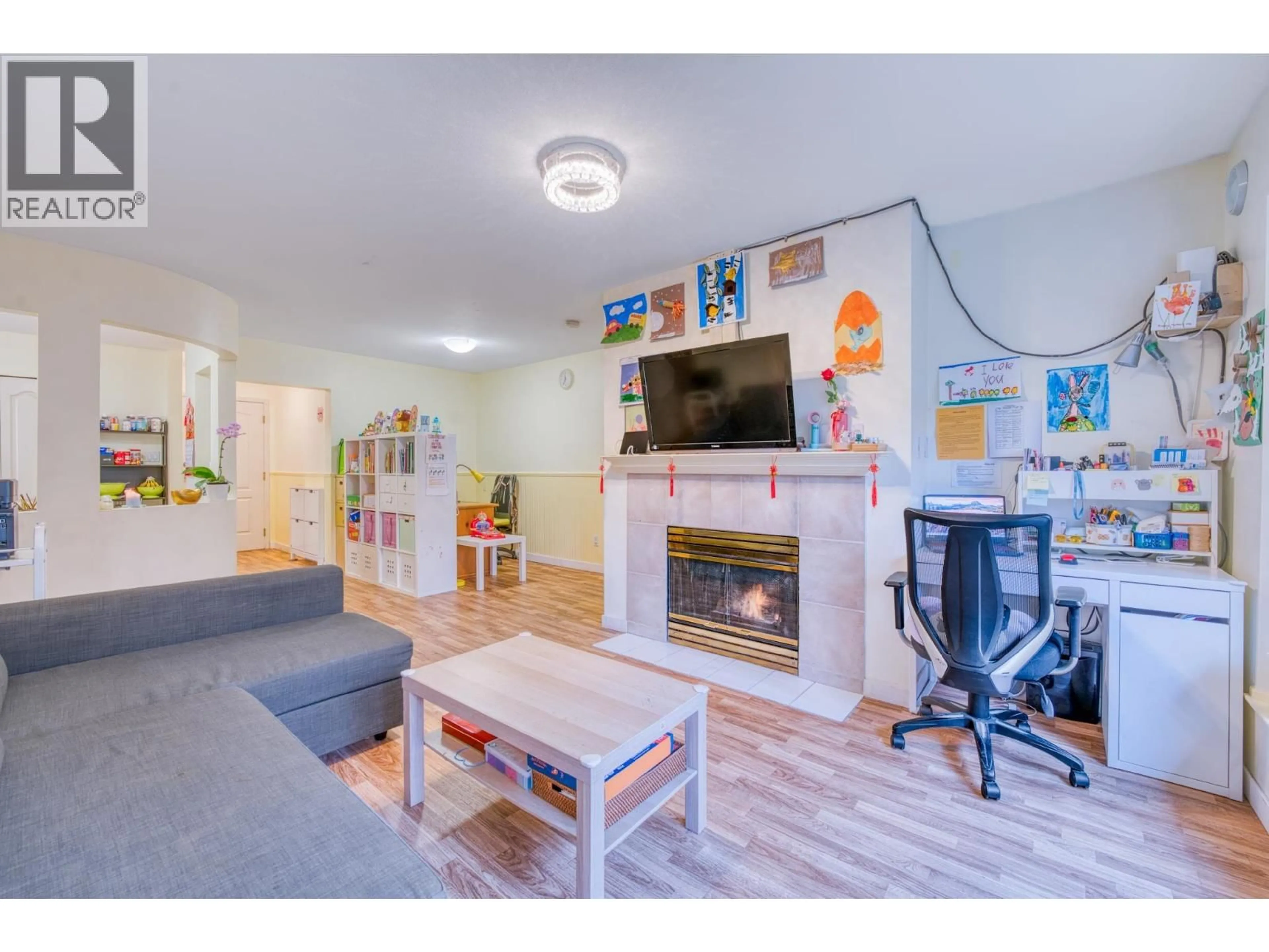 Living room with furniture, wood/laminate floor for 207 - 3738 NORFOLK STREET, Burnaby British Columbia V5G4V4