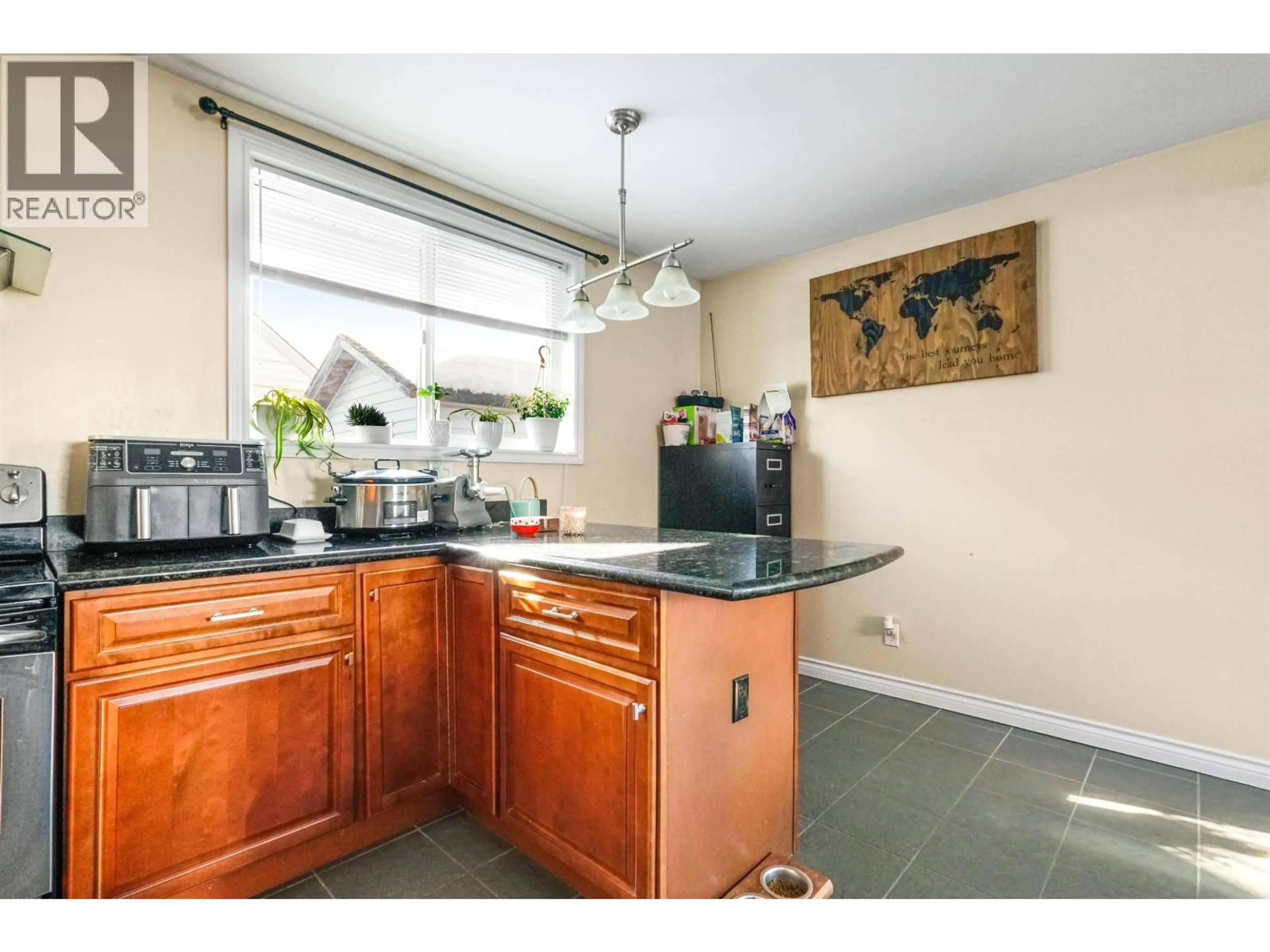 Standard kitchen, ceramic/tile floor for 11 SWALLOW STREET, Kitimat British Columbia V8C1K6