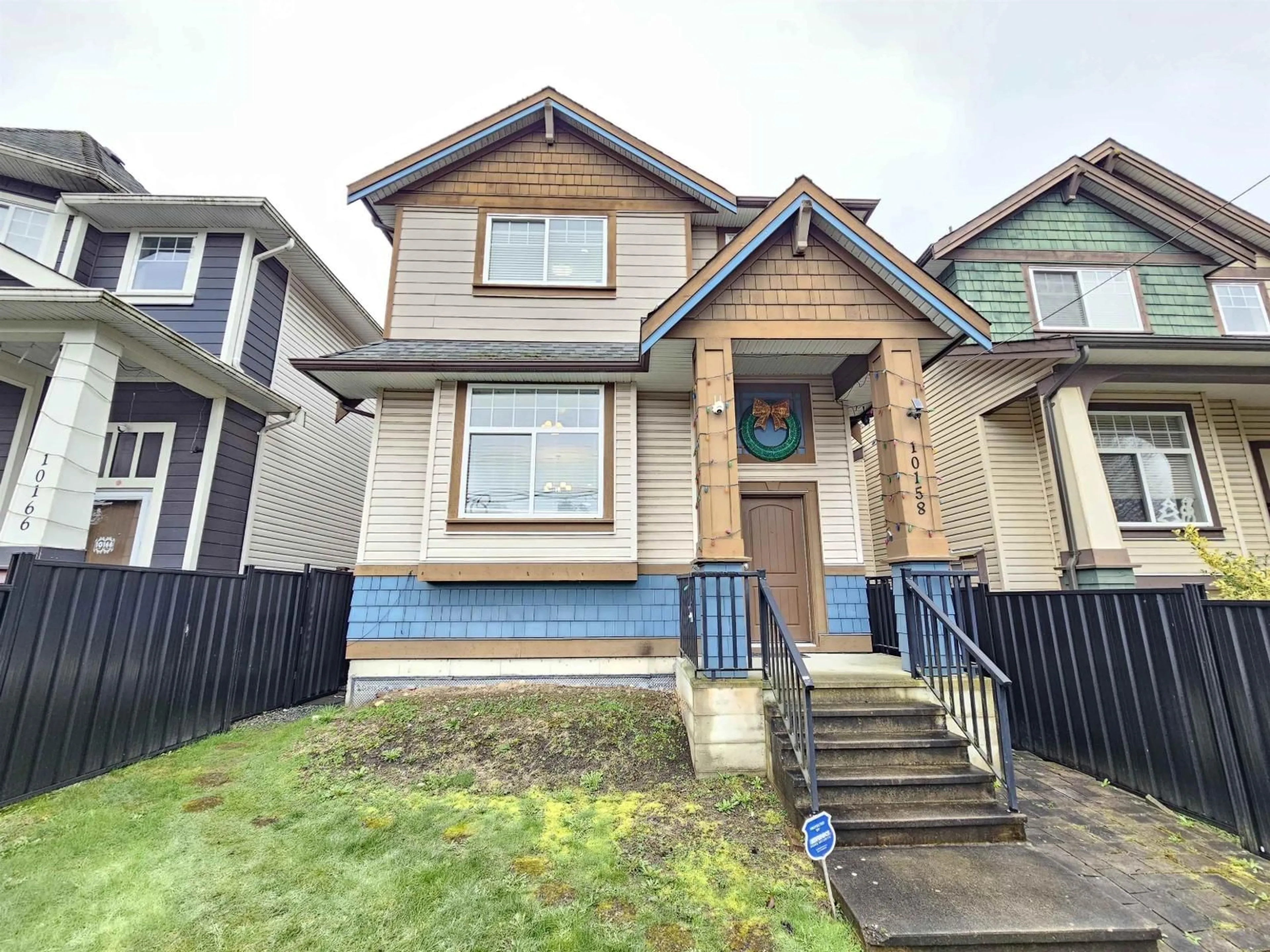 Home with vinyl exterior material, street for 10158 128 STREET, Surrey British Columbia V3T2Y9