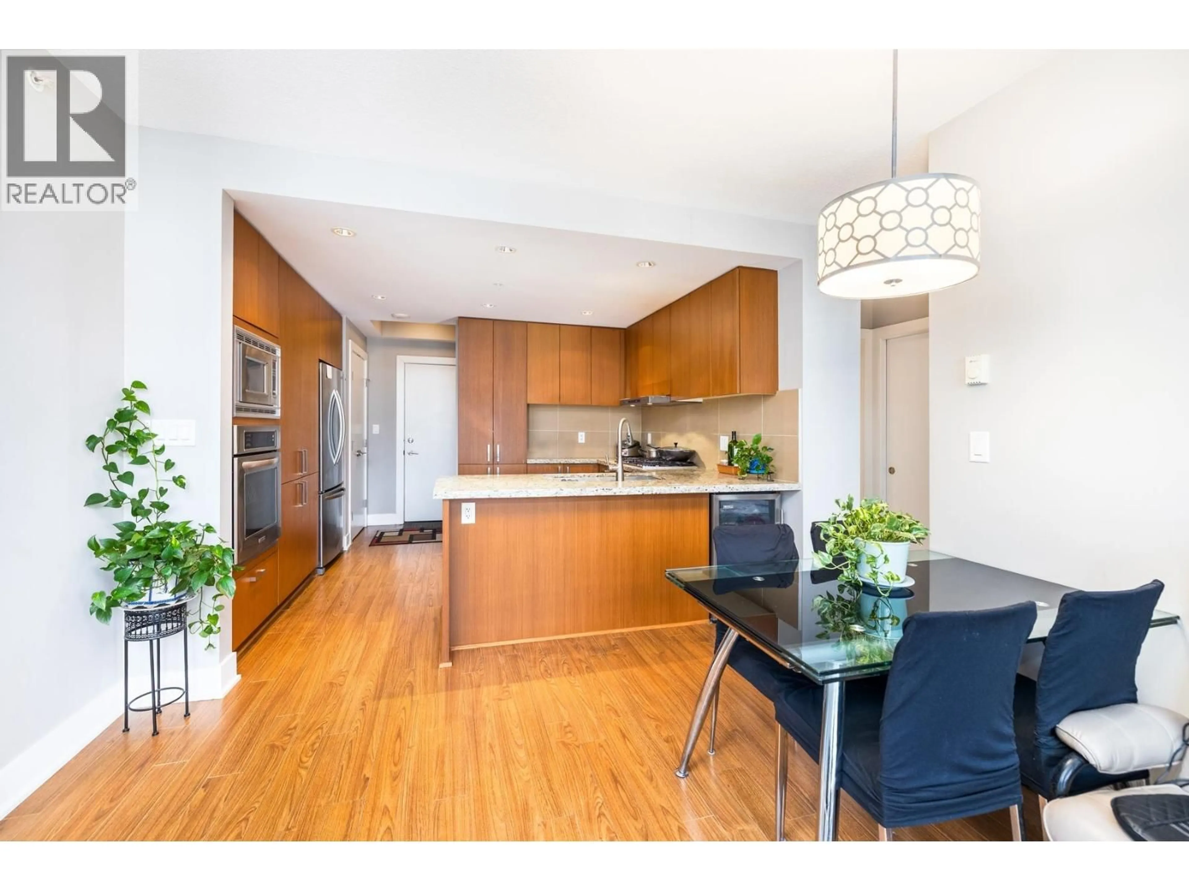 Open concept kitchen, wood/laminate floor for 2206 - 1155 THE HIGH STREET, Coquitlam British Columbia V3B7W4