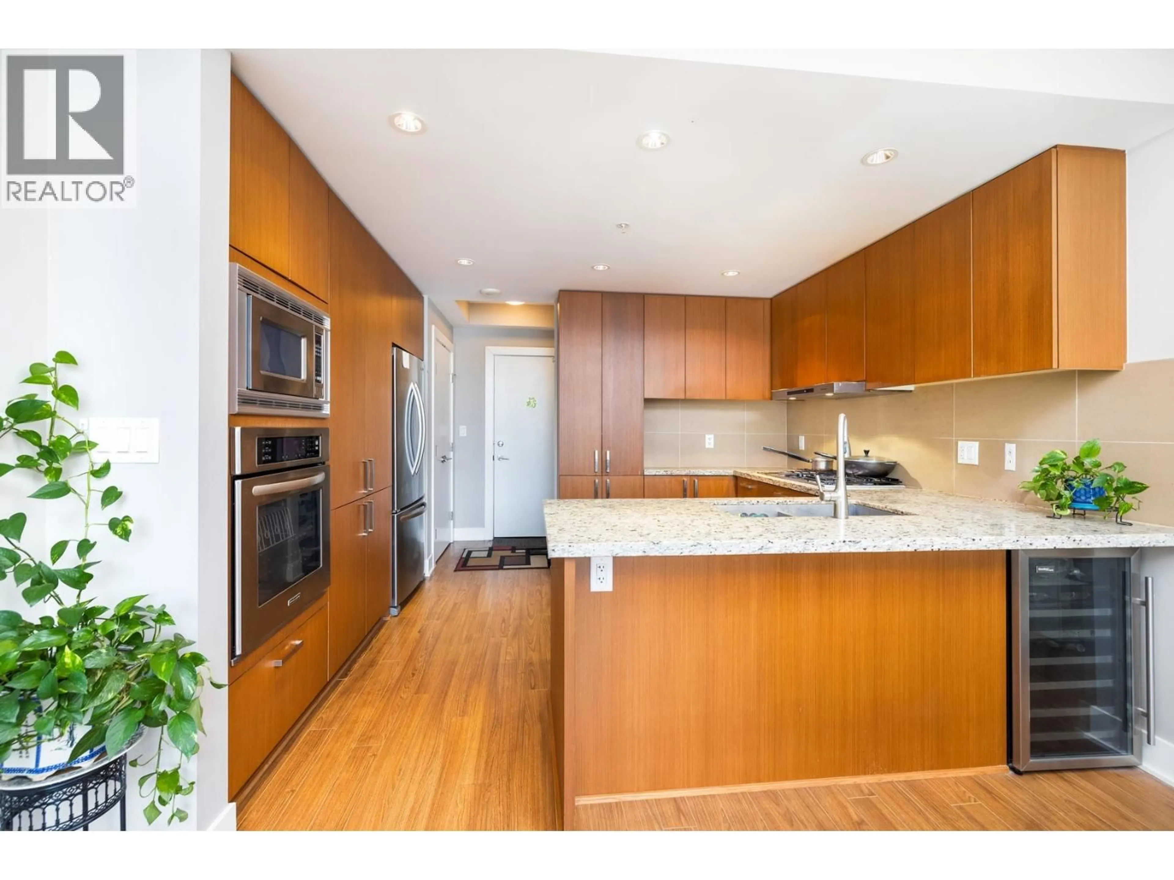 Open concept kitchen, wood/laminate floor for 2206 - 1155 THE HIGH STREET, Coquitlam British Columbia V3B7W4