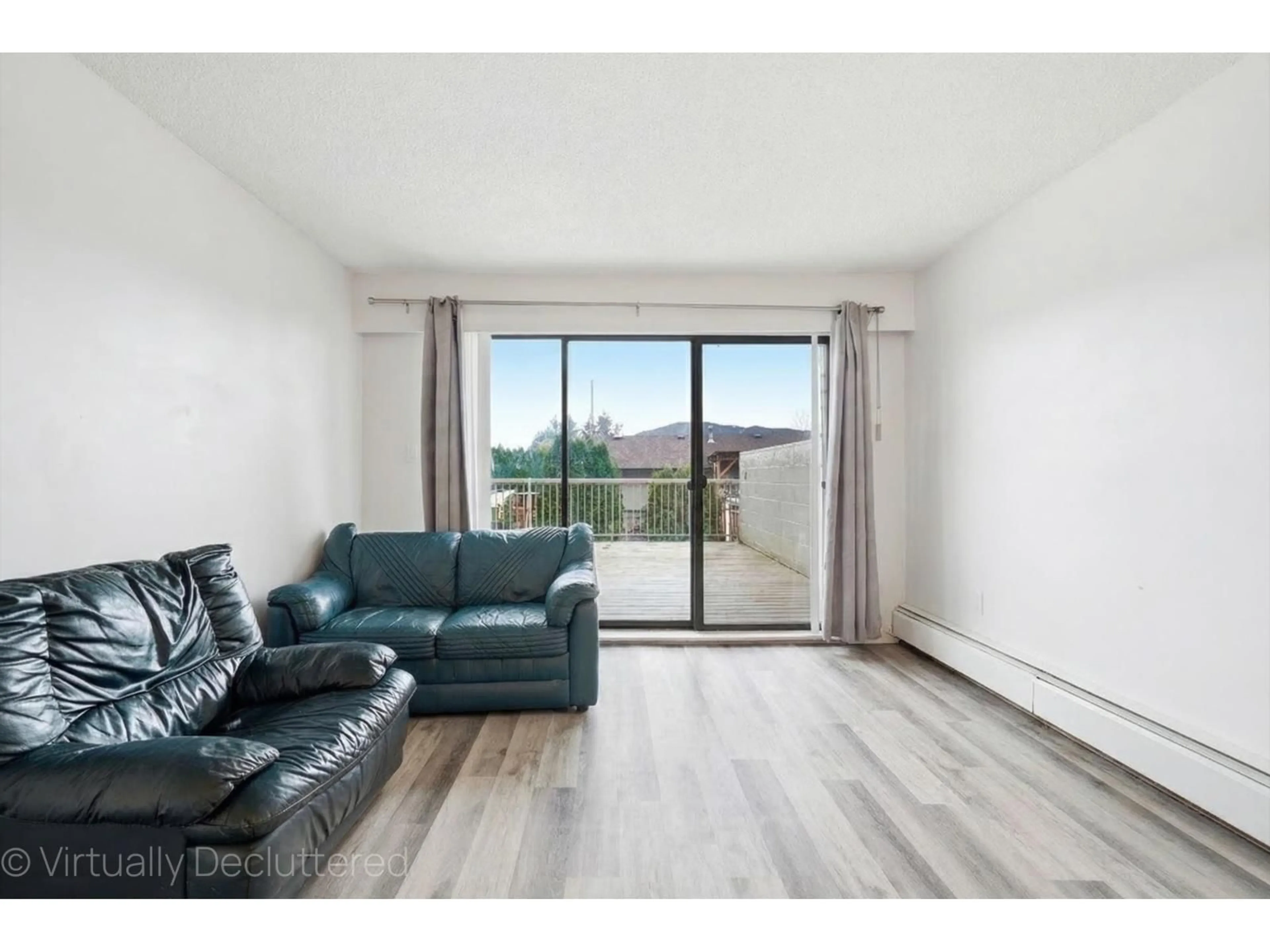 Living room with furniture, wood/laminate floor for 107 - 9477 COOK STREET, Chilliwack British Columbia V2P4J8