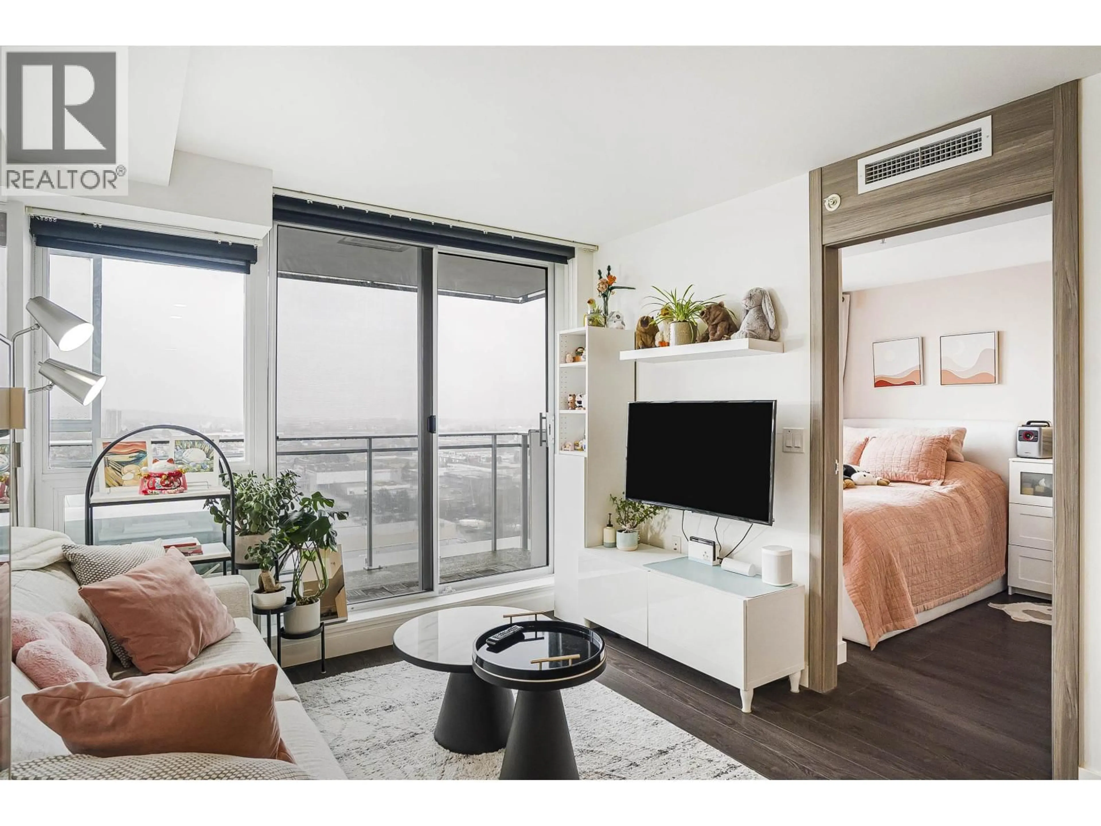 Living room with furniture, wood/laminate floor for 2505 - 433 MARINE DRIVE, Vancouver British Columbia V5X0H5