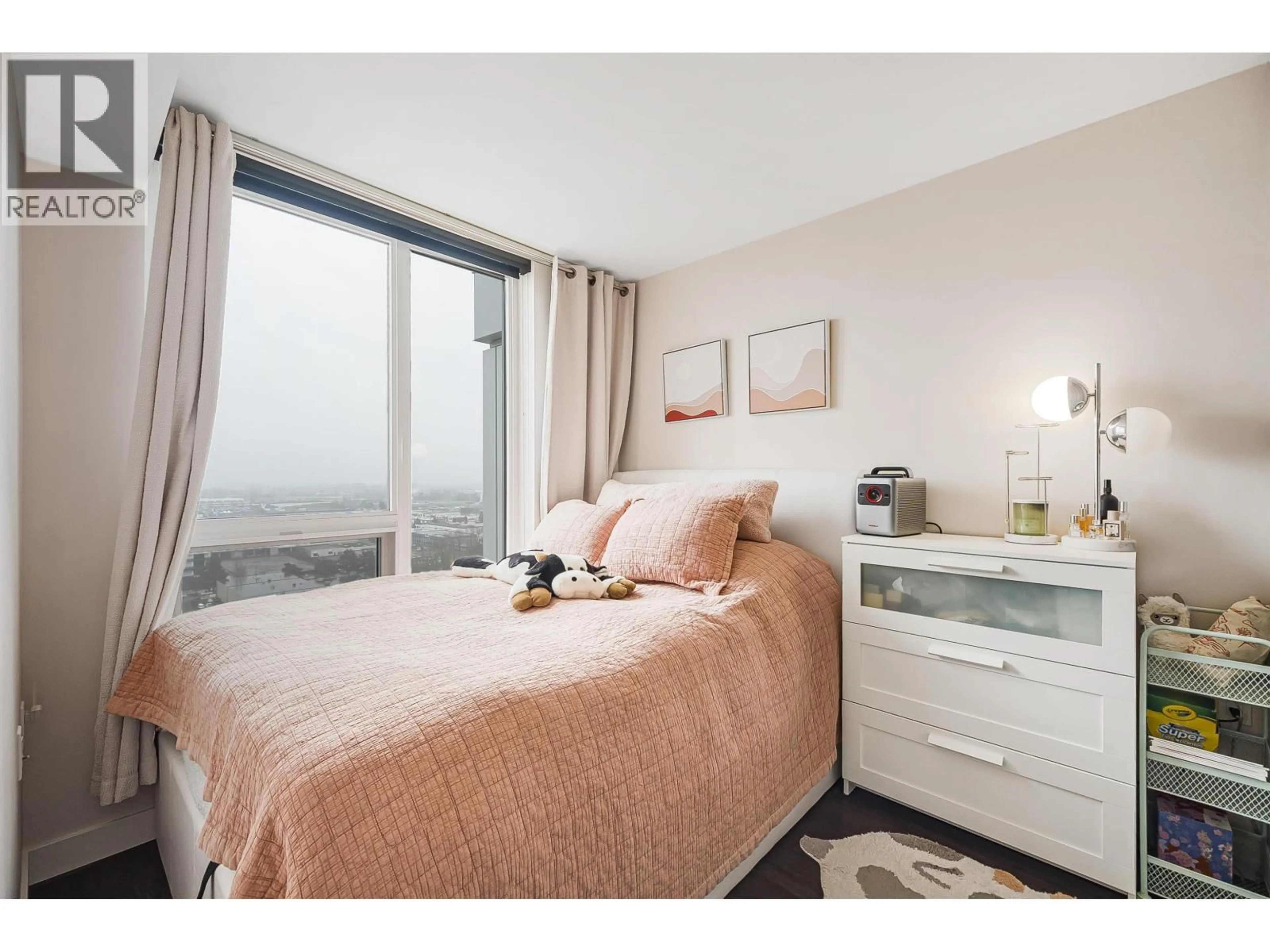 Bedroom with bed, wood/laminate floor for 2505 - 433 MARINE DRIVE, Vancouver British Columbia V5X0H5