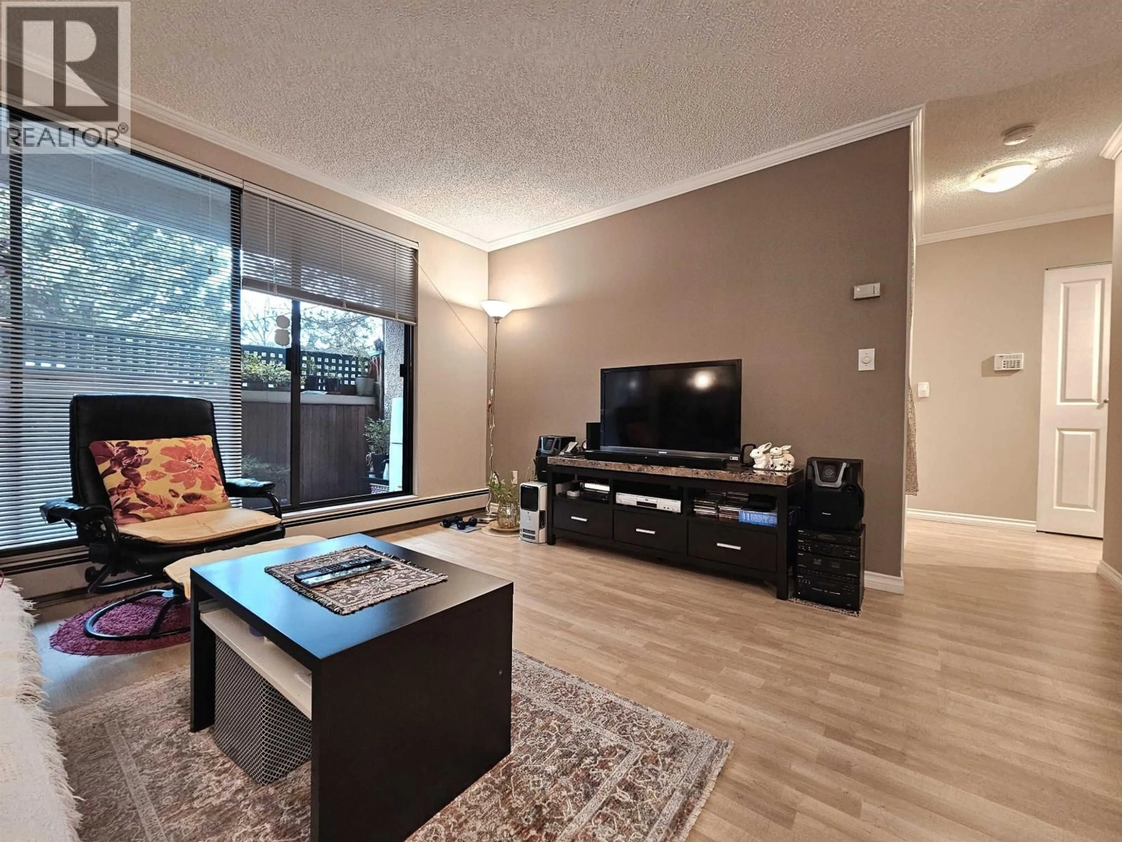 Living room with furniture, wood/laminate floor for 108 - 8540 CITATION DRIVE, Richmond British Columbia V6Y3A3