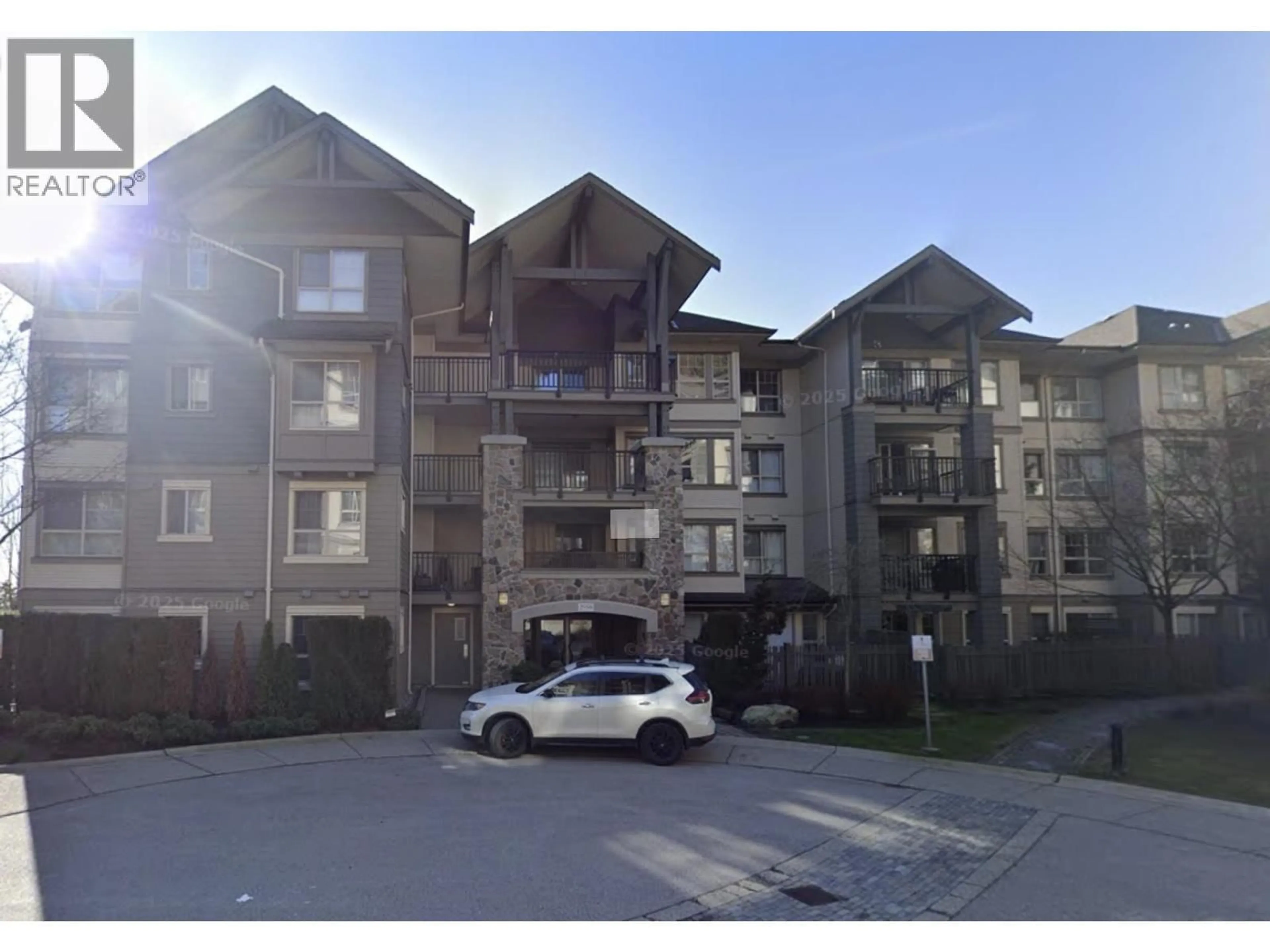 A pic from outside/outdoor area/front of a property/back of a property/a pic from drone, unknown for 303 - 2958 WHISPER WAY, Coquitlam British Columbia V3E3S7