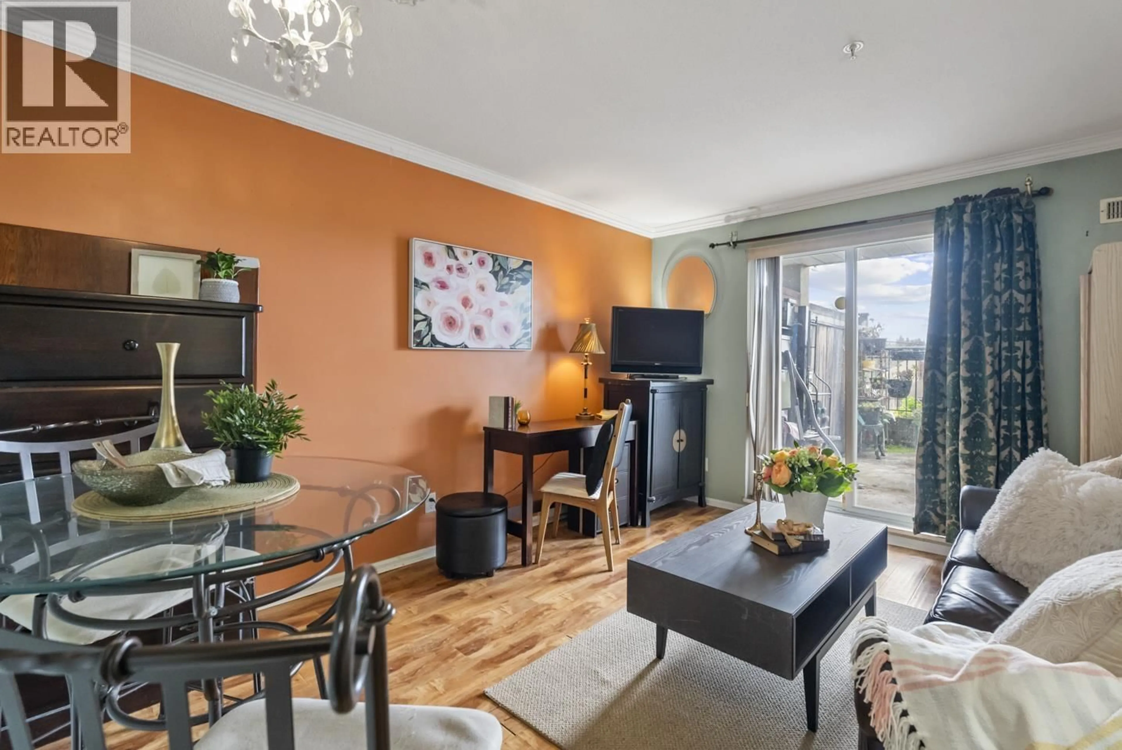 Living room with furniture, wood/laminate floor for 202 - 868 KINGSWAY WAY, Vancouver British Columbia V5V3C3