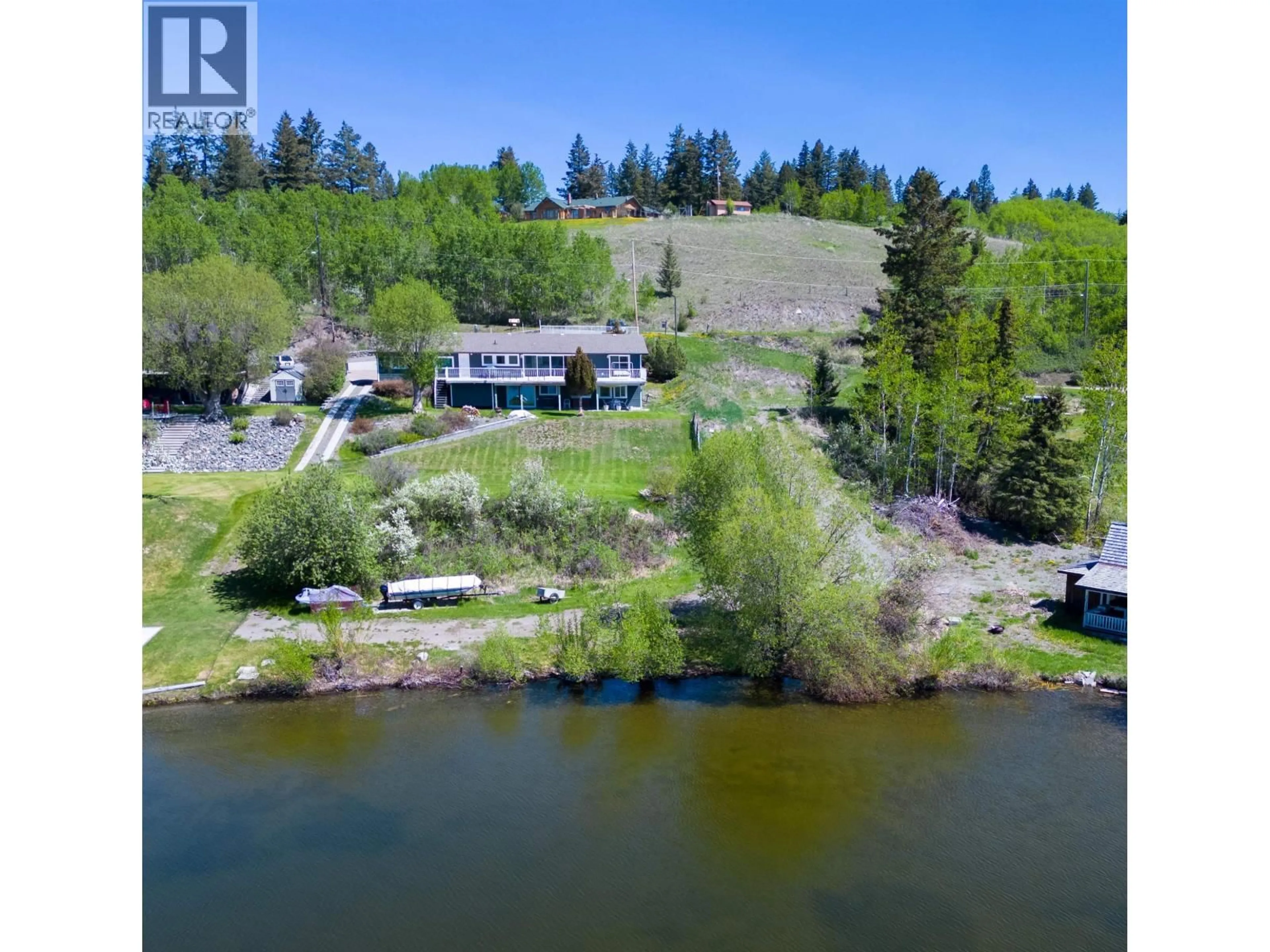 A pic from outside/outdoor area/front of a property/back of a property/a pic from drone, water/lake/river/ocean view for 4116 MCKINLEY DRIVE, Lac La Hache British Columbia V0K1T0