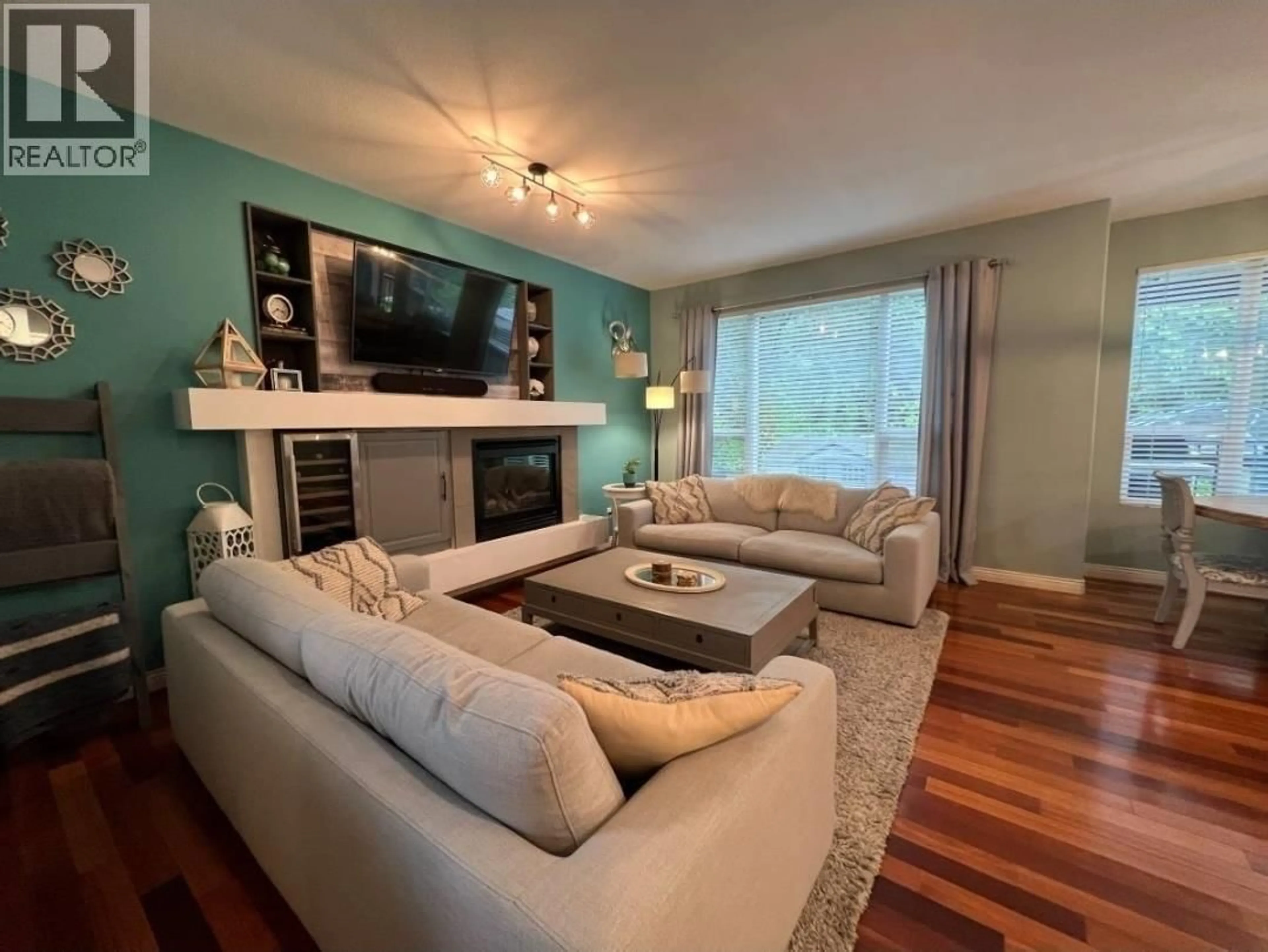 Living room with furniture, wood/laminate floor for 24330 100B AVENUE, Maple Ridge British Columbia V2W1X3