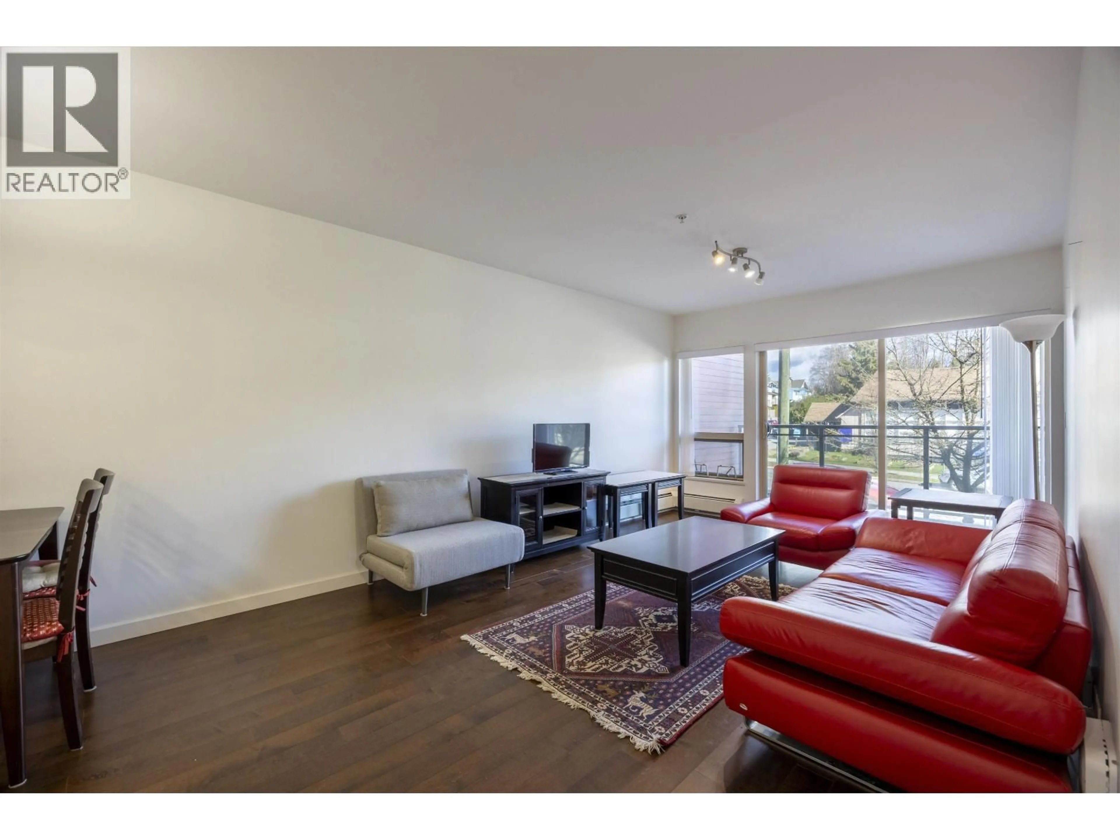 Living room with furniture, wood/laminate floor for 206 - 1033 ST. GEORGES AVENUE, North Vancouver British Columbia V7L3H5