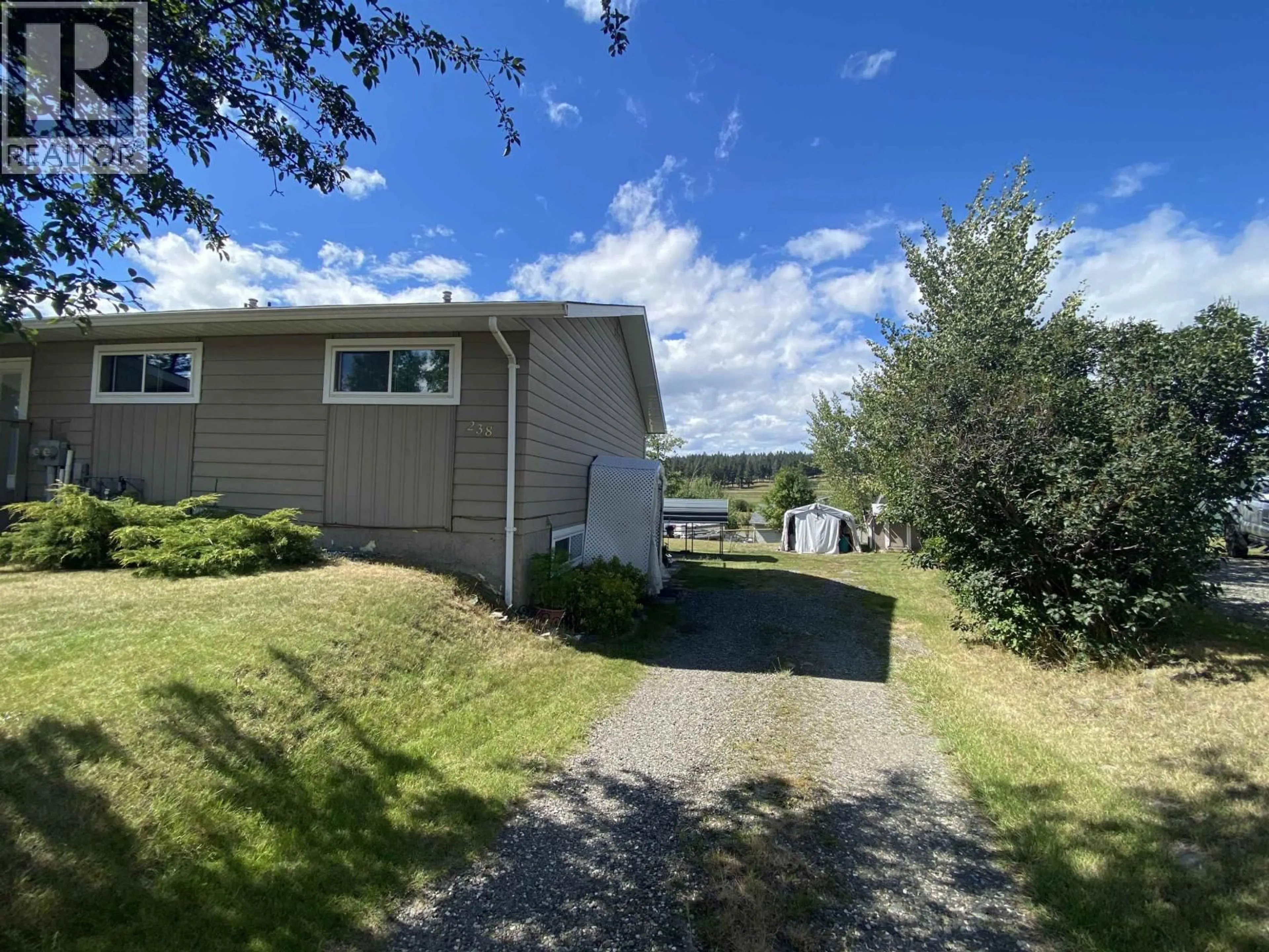 A pic from outside/outdoor area/front of a property/back of a property/a pic from drone, unknown for 238 ELM AVENUE, 100 Mile House British Columbia V0K2E0