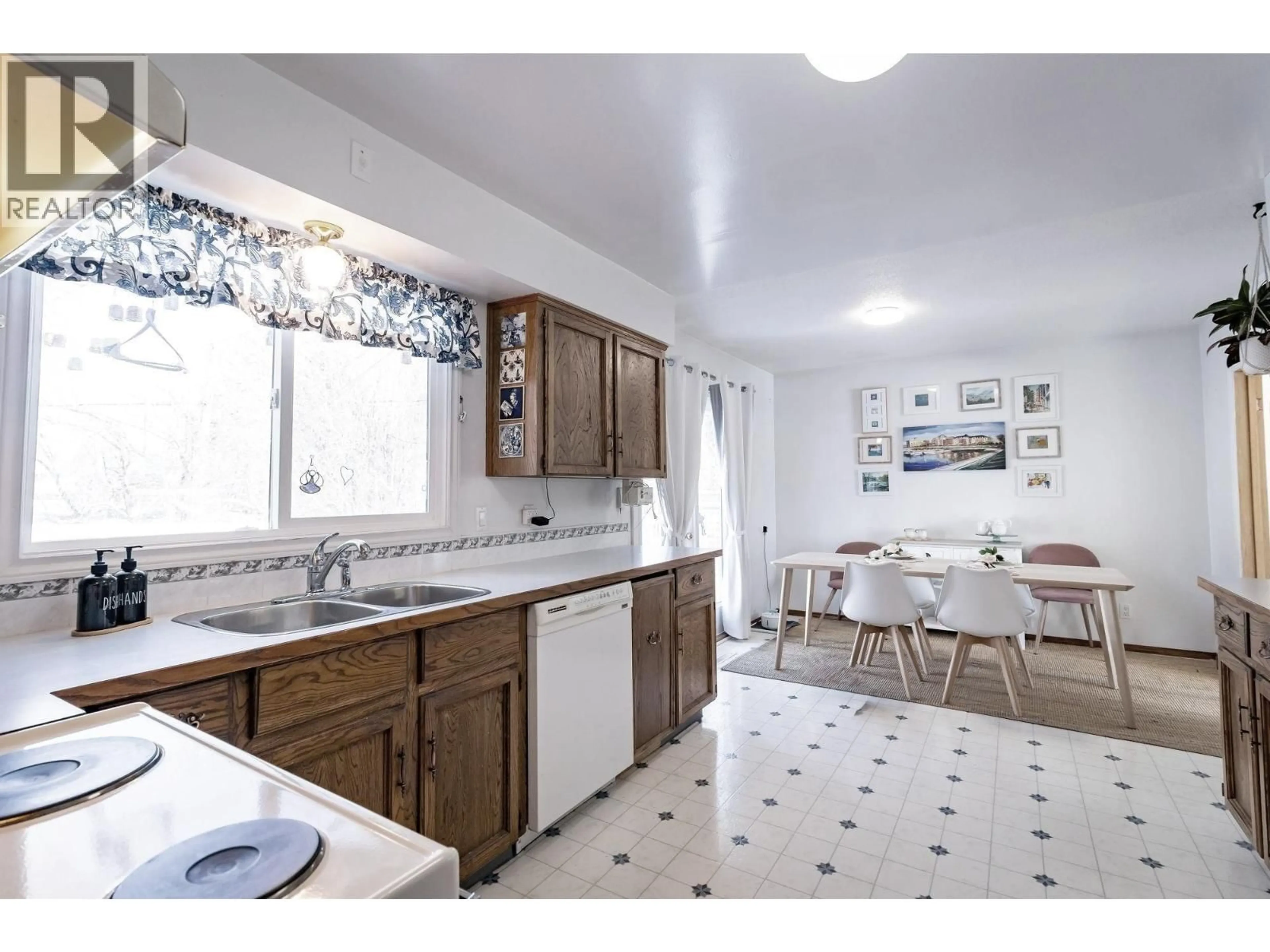 Open concept kitchen, ceramic/tile floor for 11323 94 STREET, Fort St. John British Columbia V1J3M1