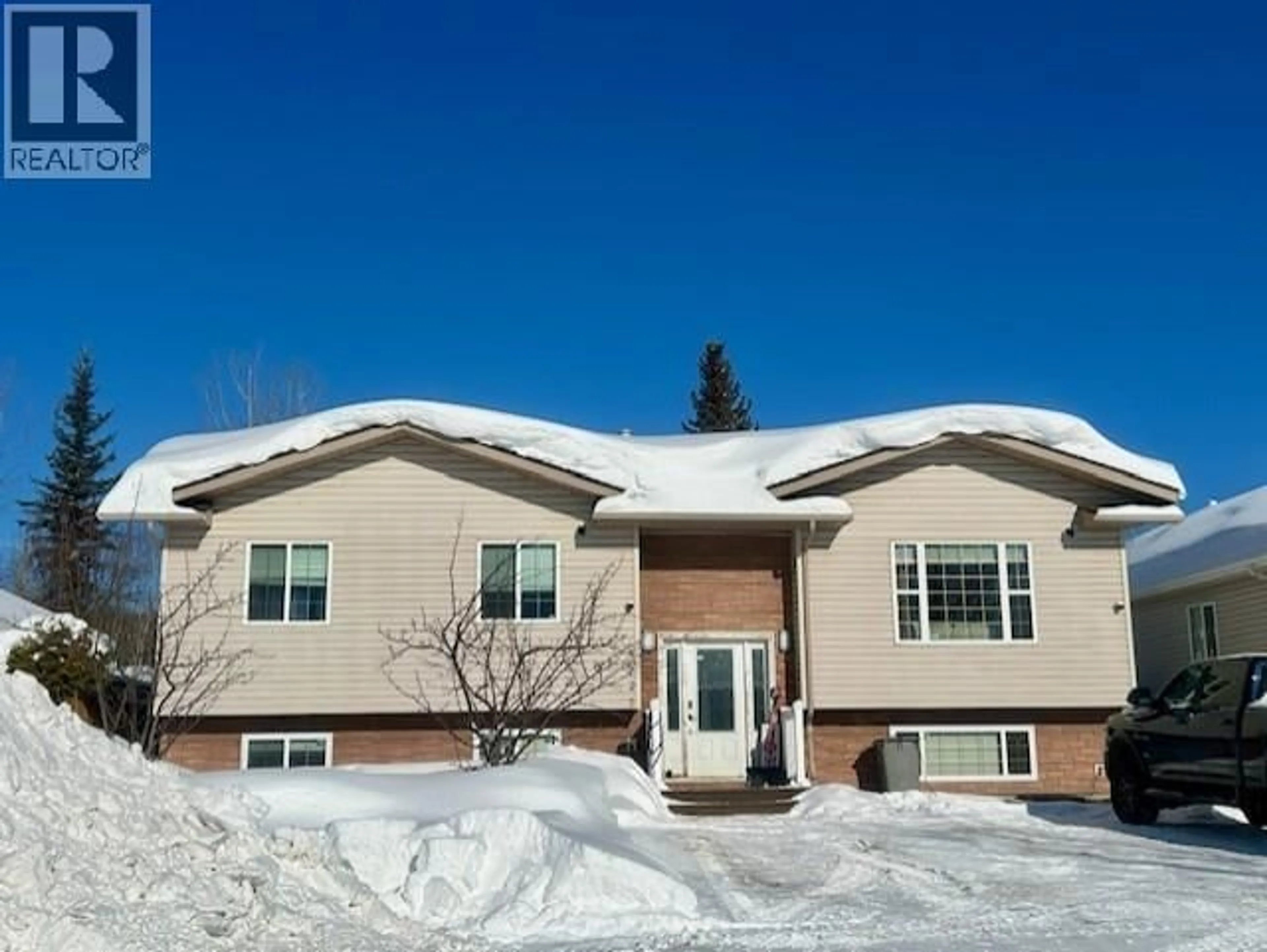 Home with vinyl exterior material, street for 5227 HALLMARK CRESCENT, Fort Nelson British Columbia V0C1R0