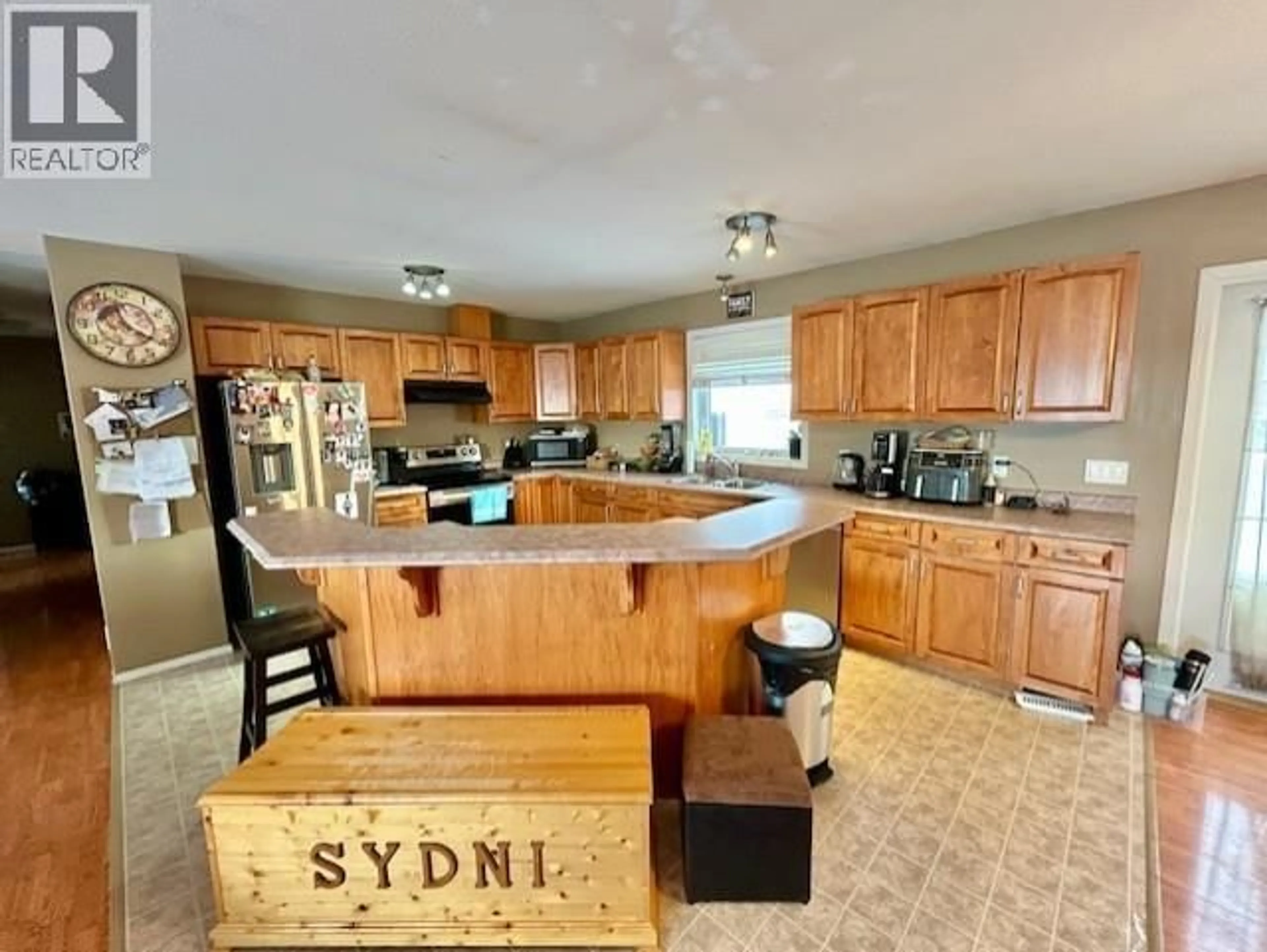 Open concept kitchen, wood/laminate floor for 5227 HALLMARK CRESCENT, Fort Nelson British Columbia V0C1R0