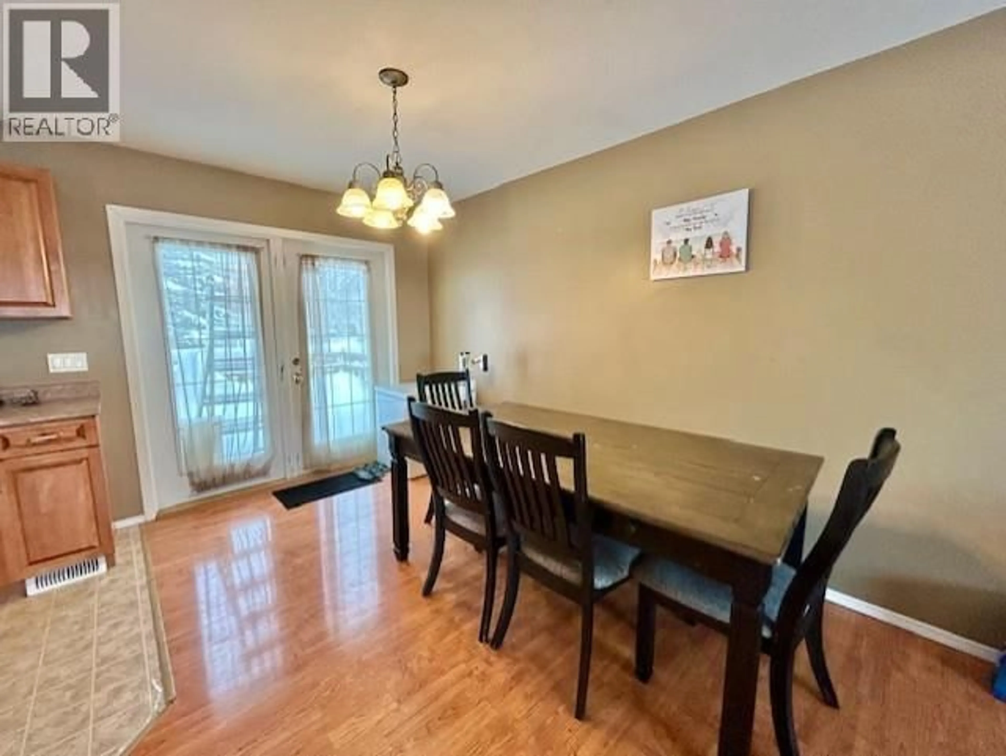 Dining room, wood/laminate floor for 5227 HALLMARK CRESCENT, Fort Nelson British Columbia V0C1R0
