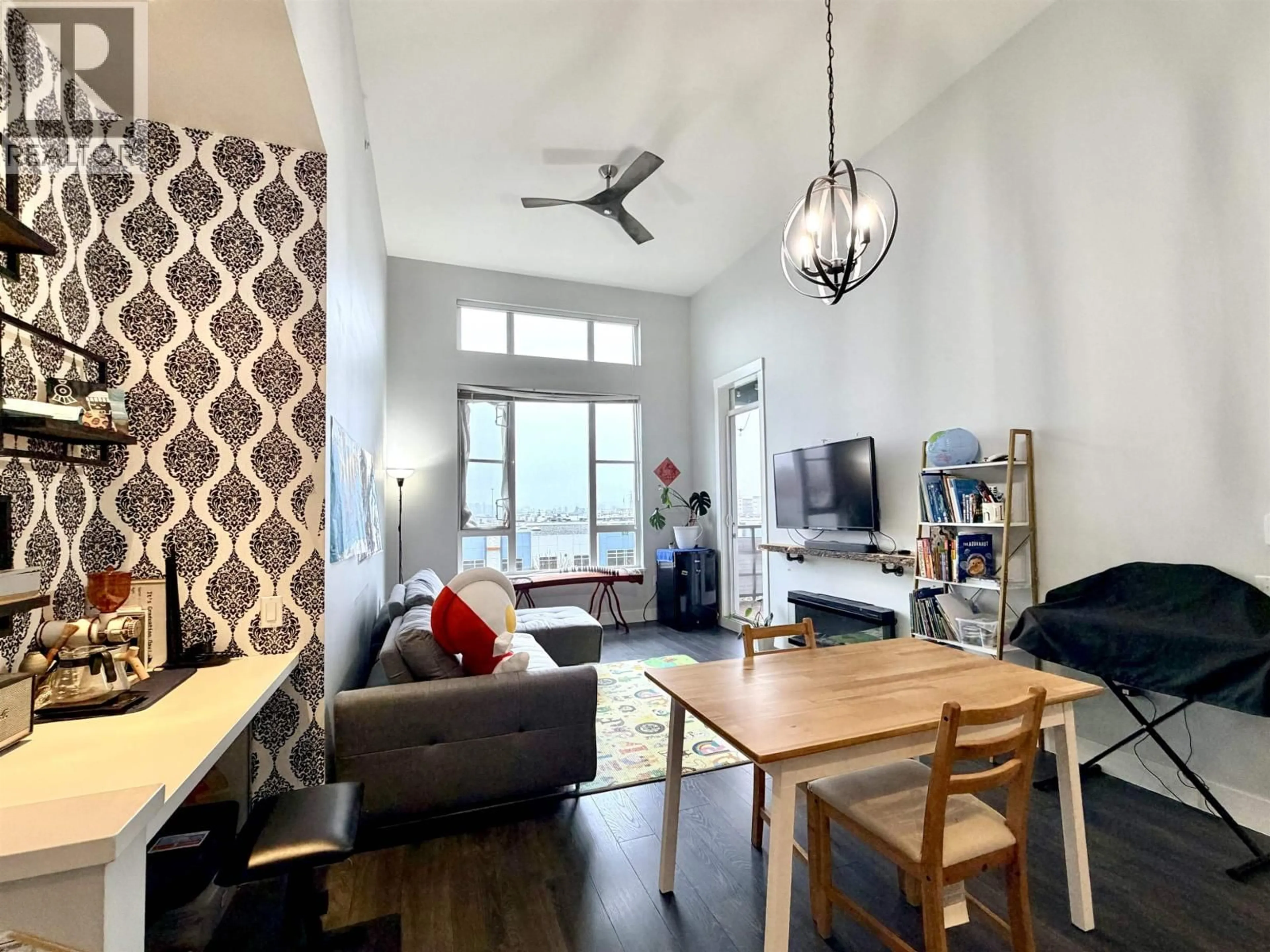 Living room with furniture, wood/laminate floor for 406 - 2307 RANGER LANE, Port Coquitlam British Columbia V3B0L7