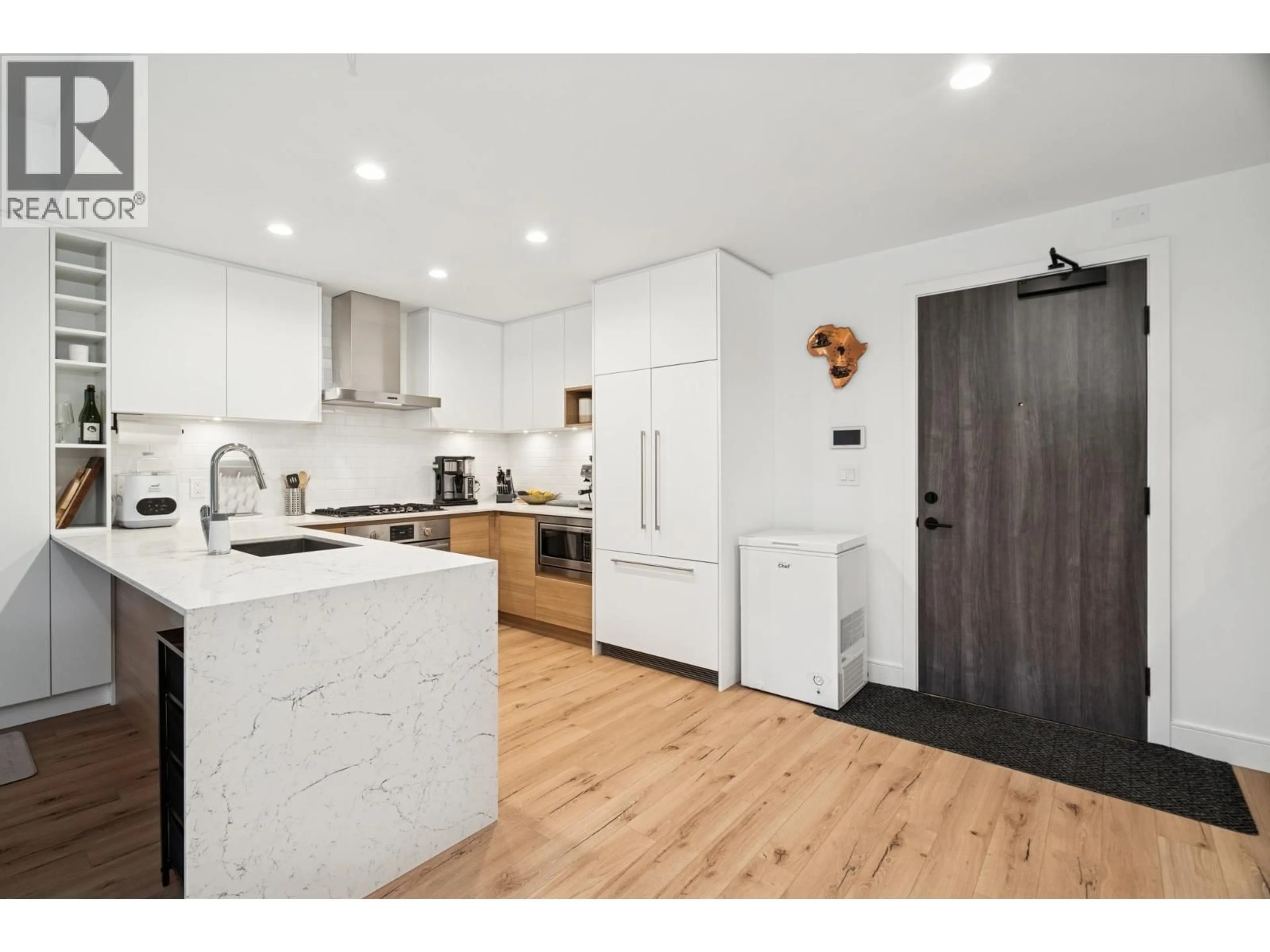 Open concept kitchen, wood/laminate floor for 420 - 55 KLAHANIE DRIVE, Port Moody British Columbia V3H0M9