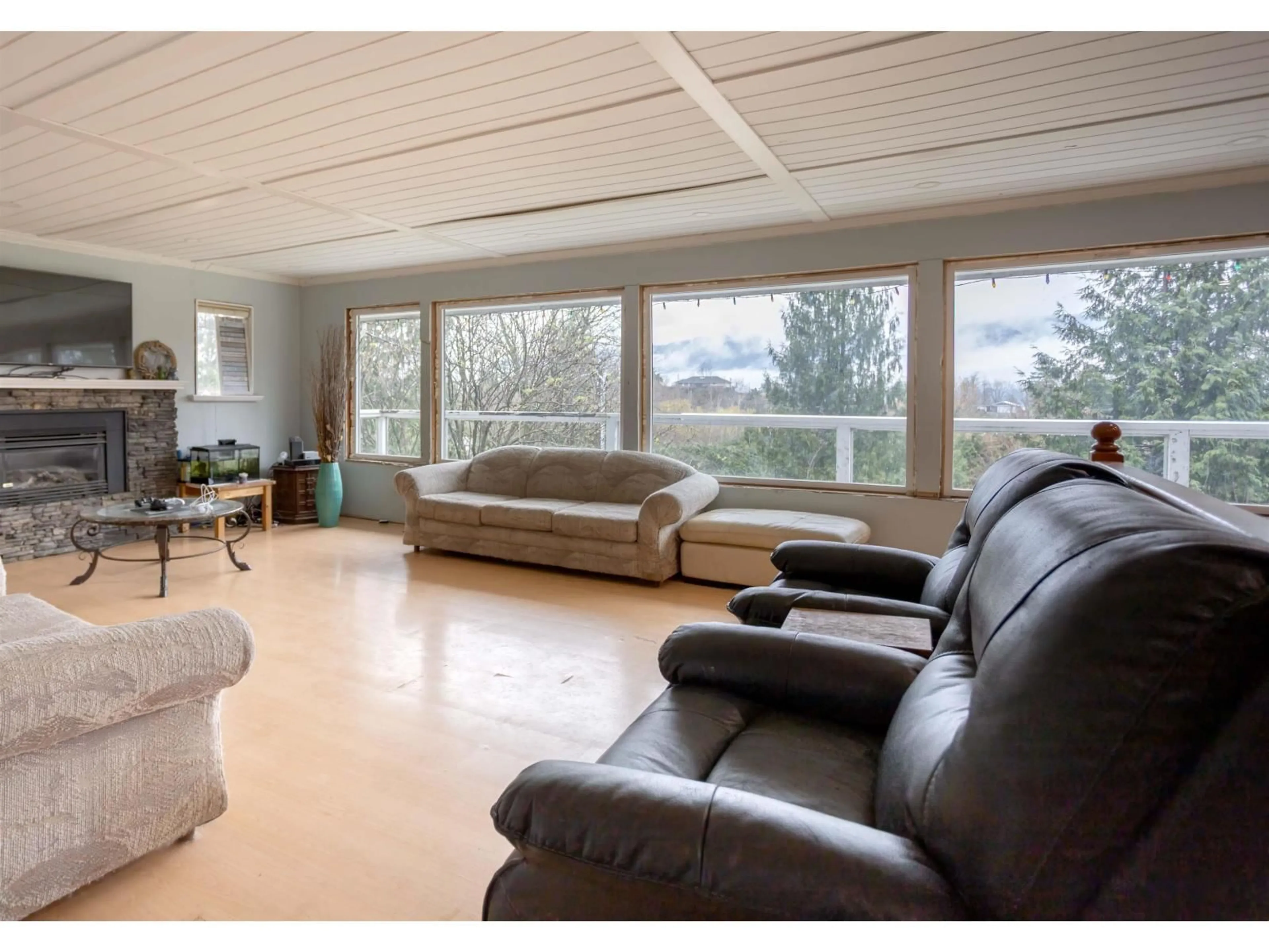 Living room with furniture, wood/laminate floor for 42140 MAJUBA HILL ROAD, Yarrow British Columbia V2R5H2