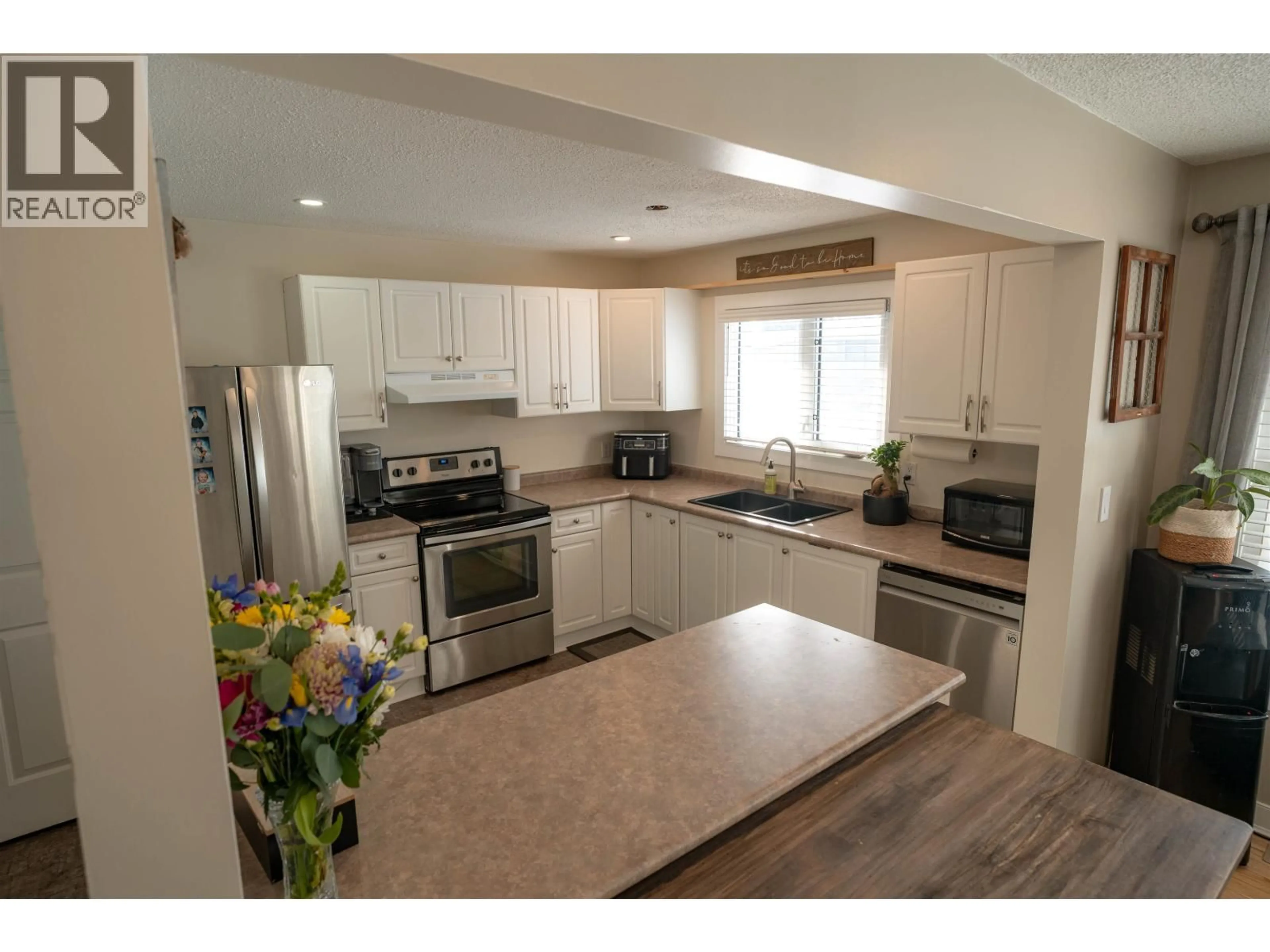 Open concept kitchen, unknown for 9003 89 STREET, Fort St. John British Columbia V1J5B9