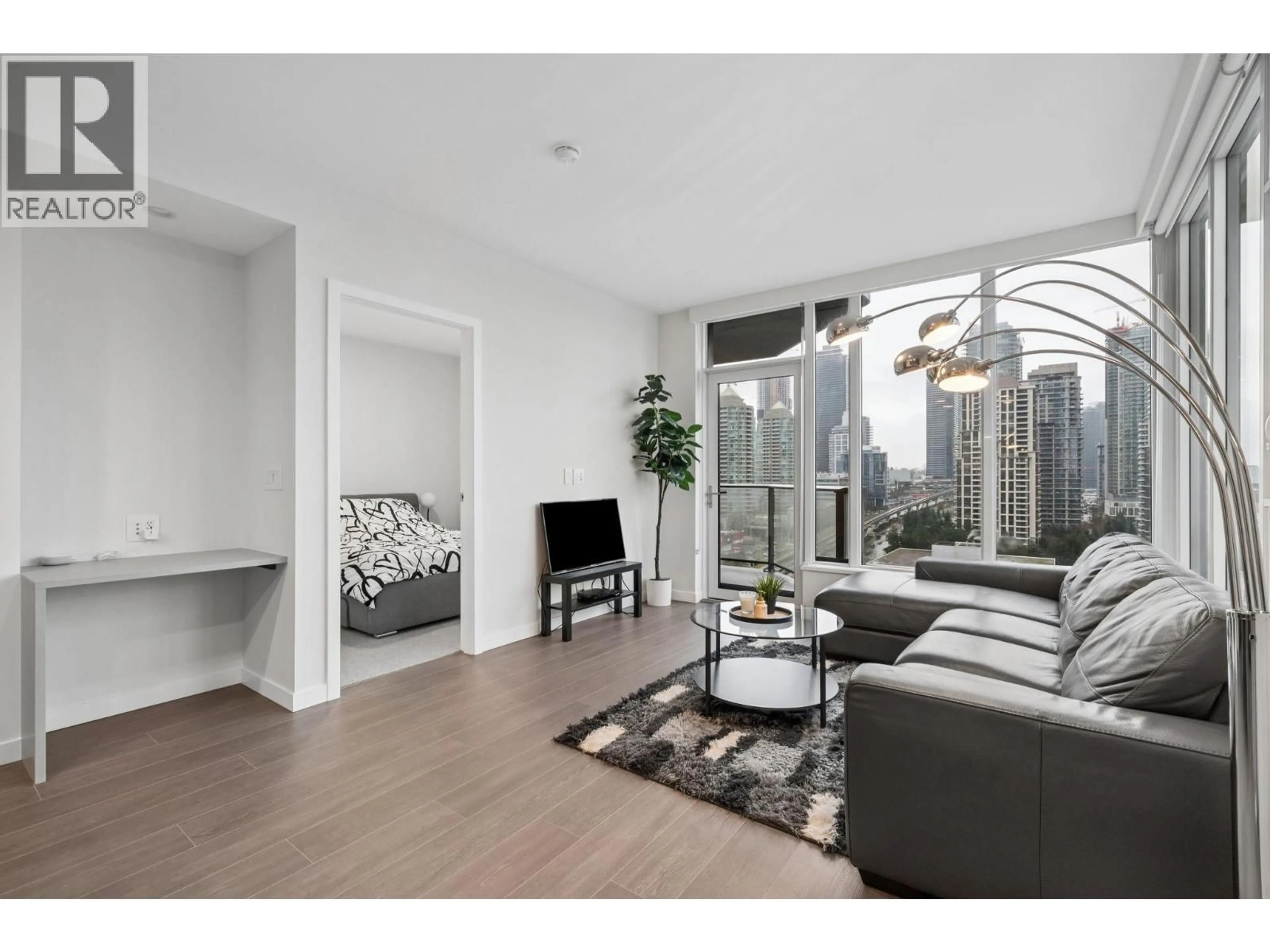 Living room with furniture, wood/laminate floor for 1410 - 4168 LOUGHEED HIGHWAY, Burnaby British Columbia V5C0N9