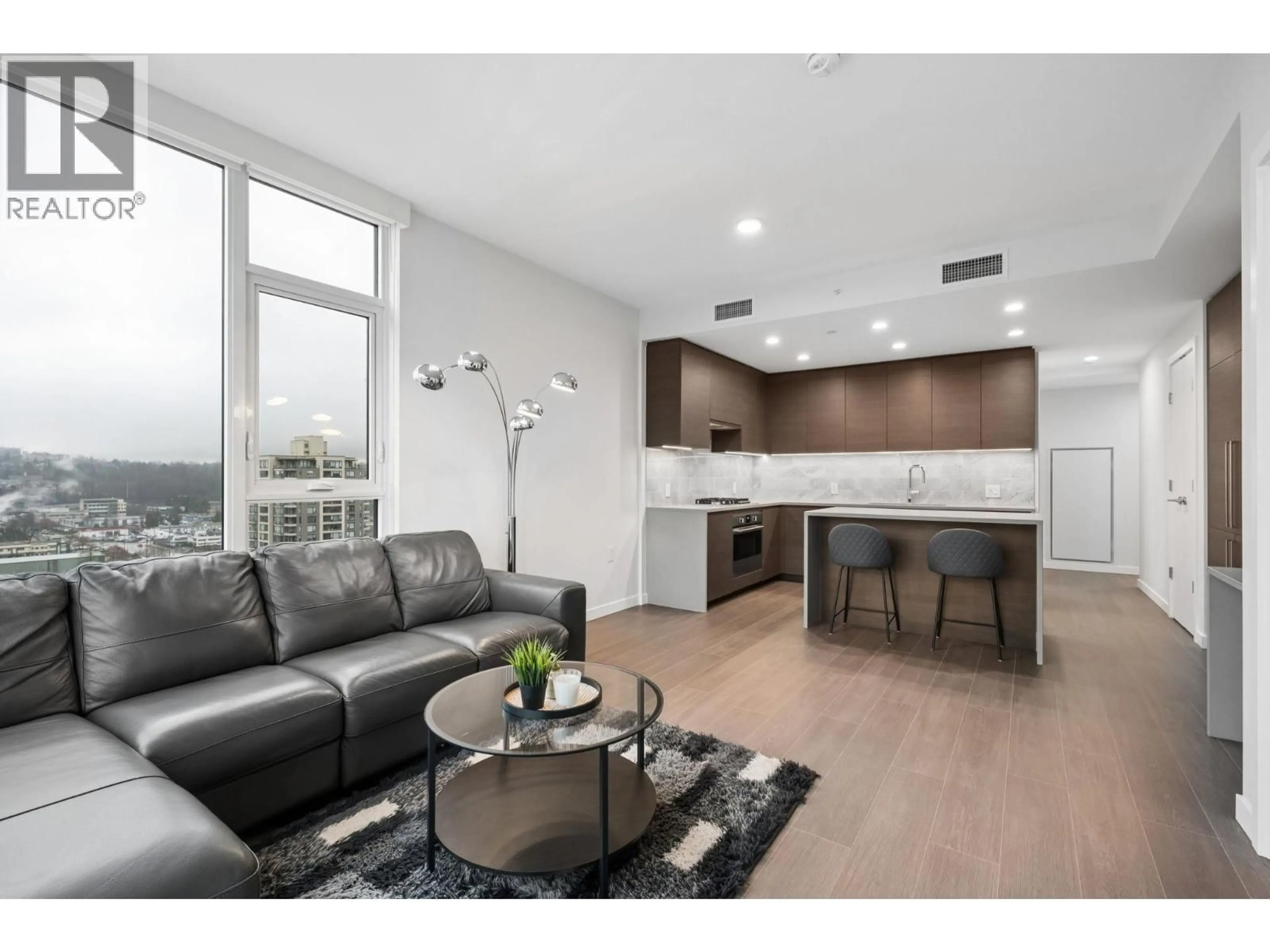 Living room with furniture, unknown for 1410 - 4168 LOUGHEED HIGHWAY, Burnaby British Columbia V5C0N9