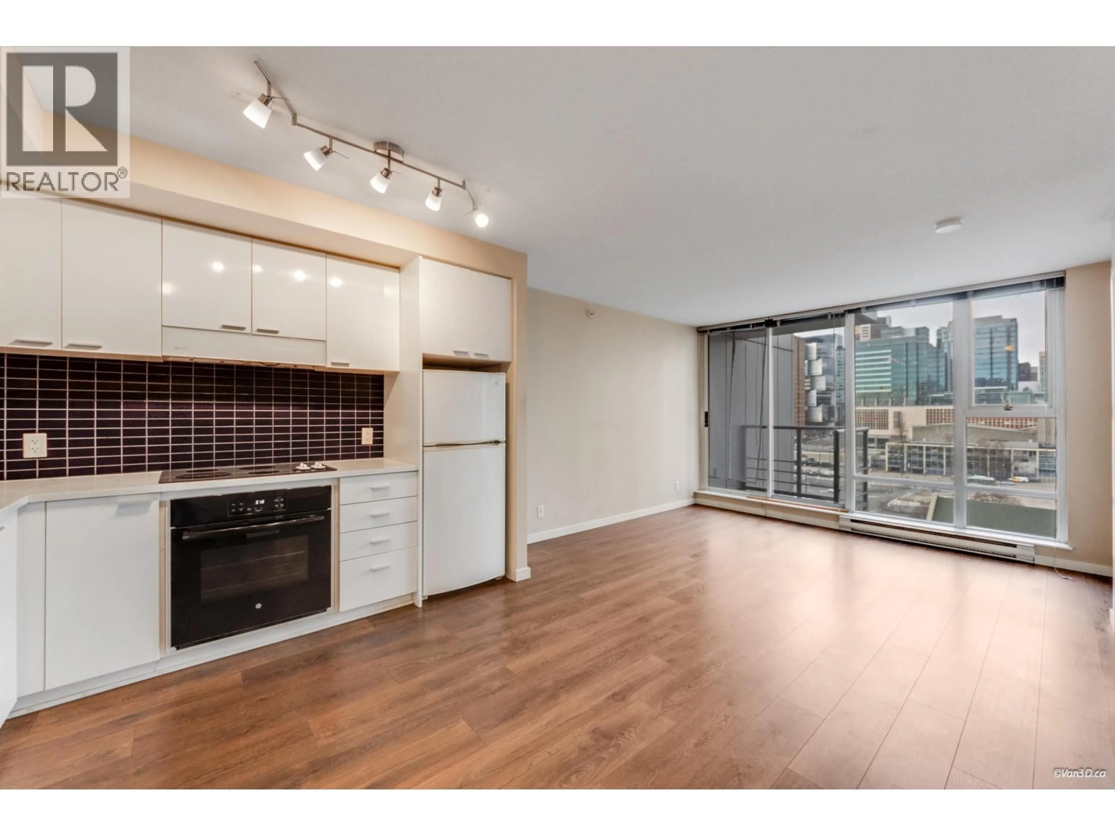 Open concept kitchen, wood/laminate floor for 1209 - 131 REGIMENT SQUARE, Vancouver British Columbia V6B1X6