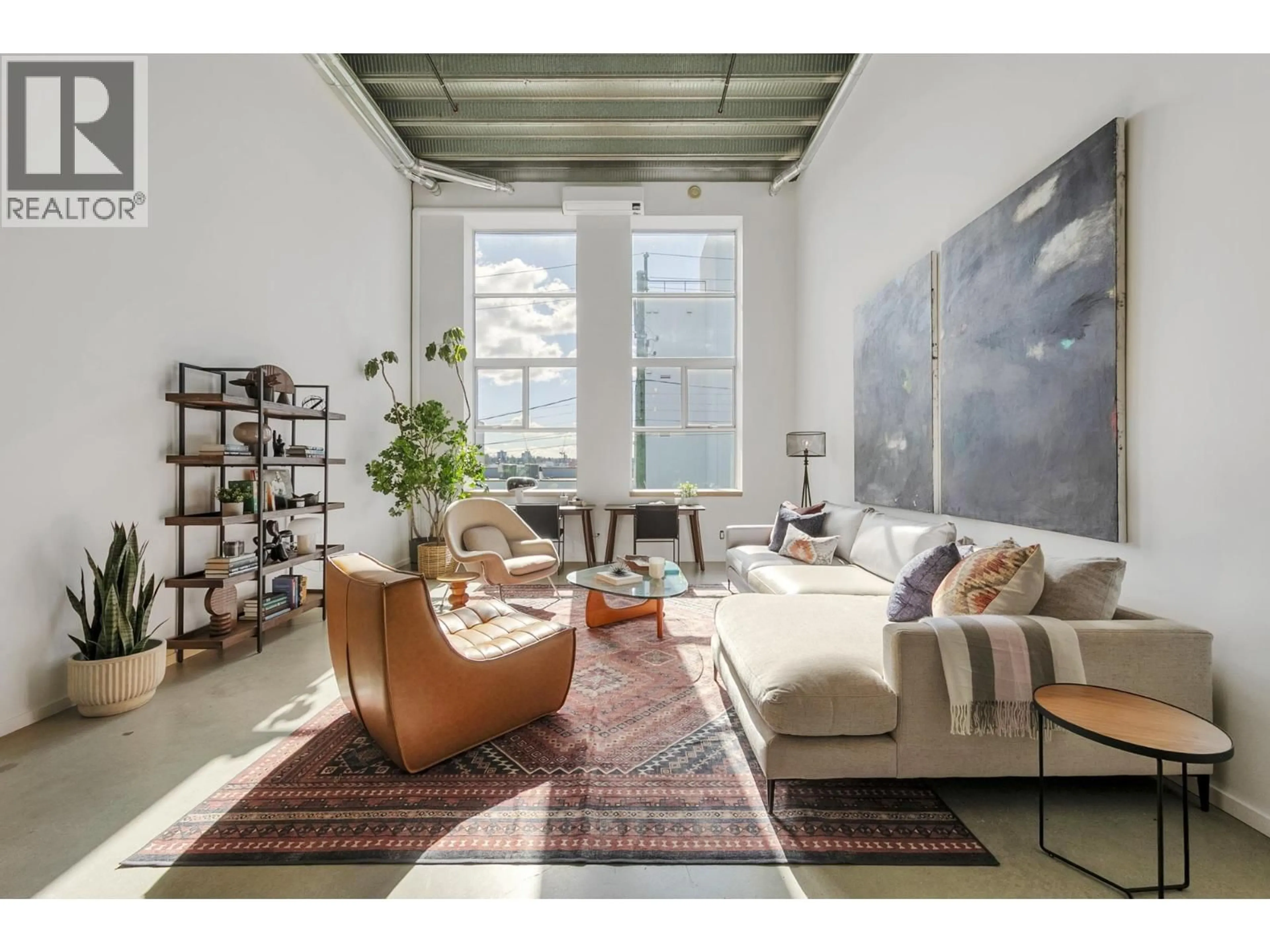 Living room with furniture, cement floor for 215 - 1220 PENDER STREET, Vancouver British Columbia V6A1W8