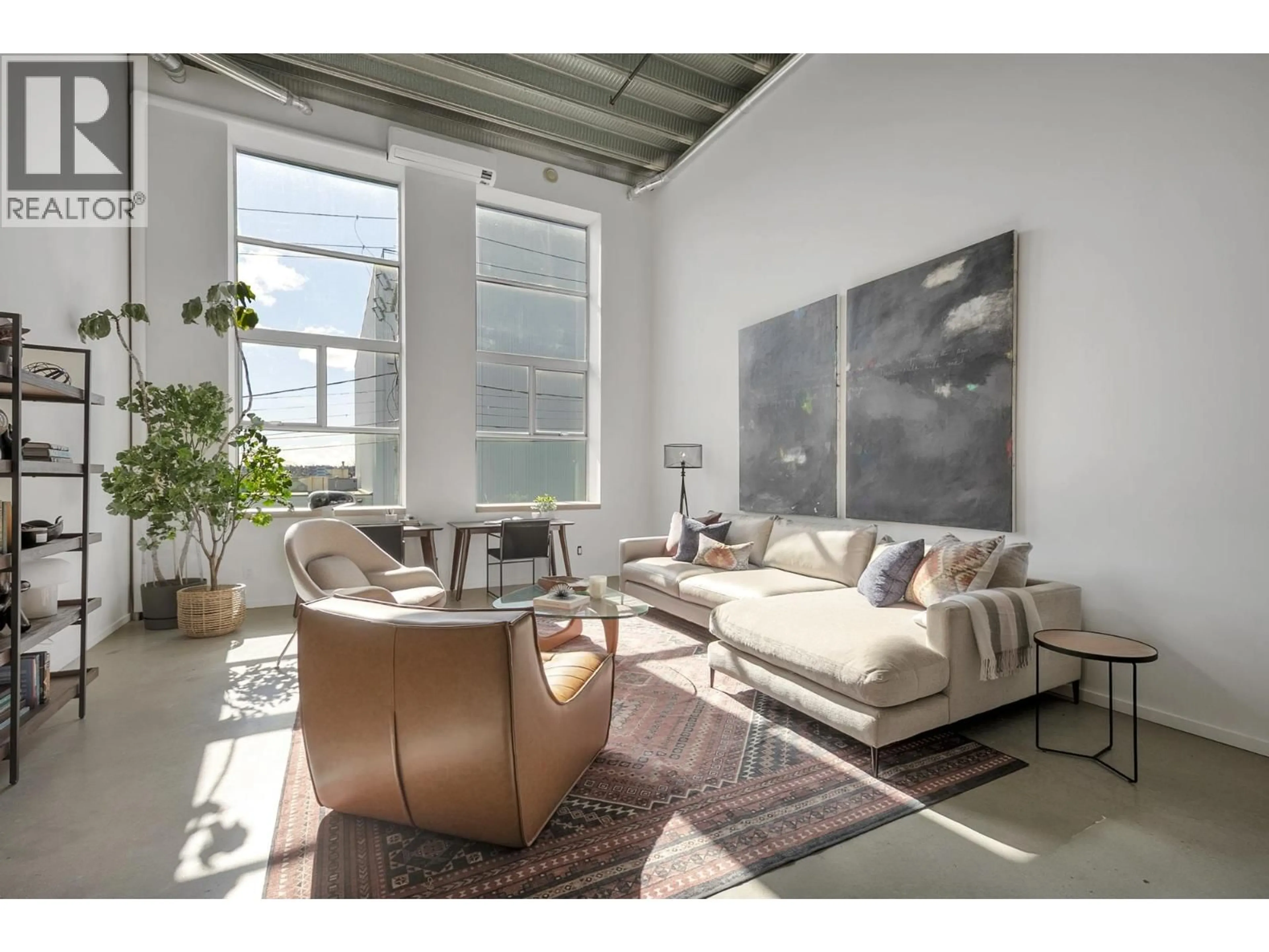 Living room with furniture, cement floor for 215 - 1220 PENDER STREET, Vancouver British Columbia V6A1W8