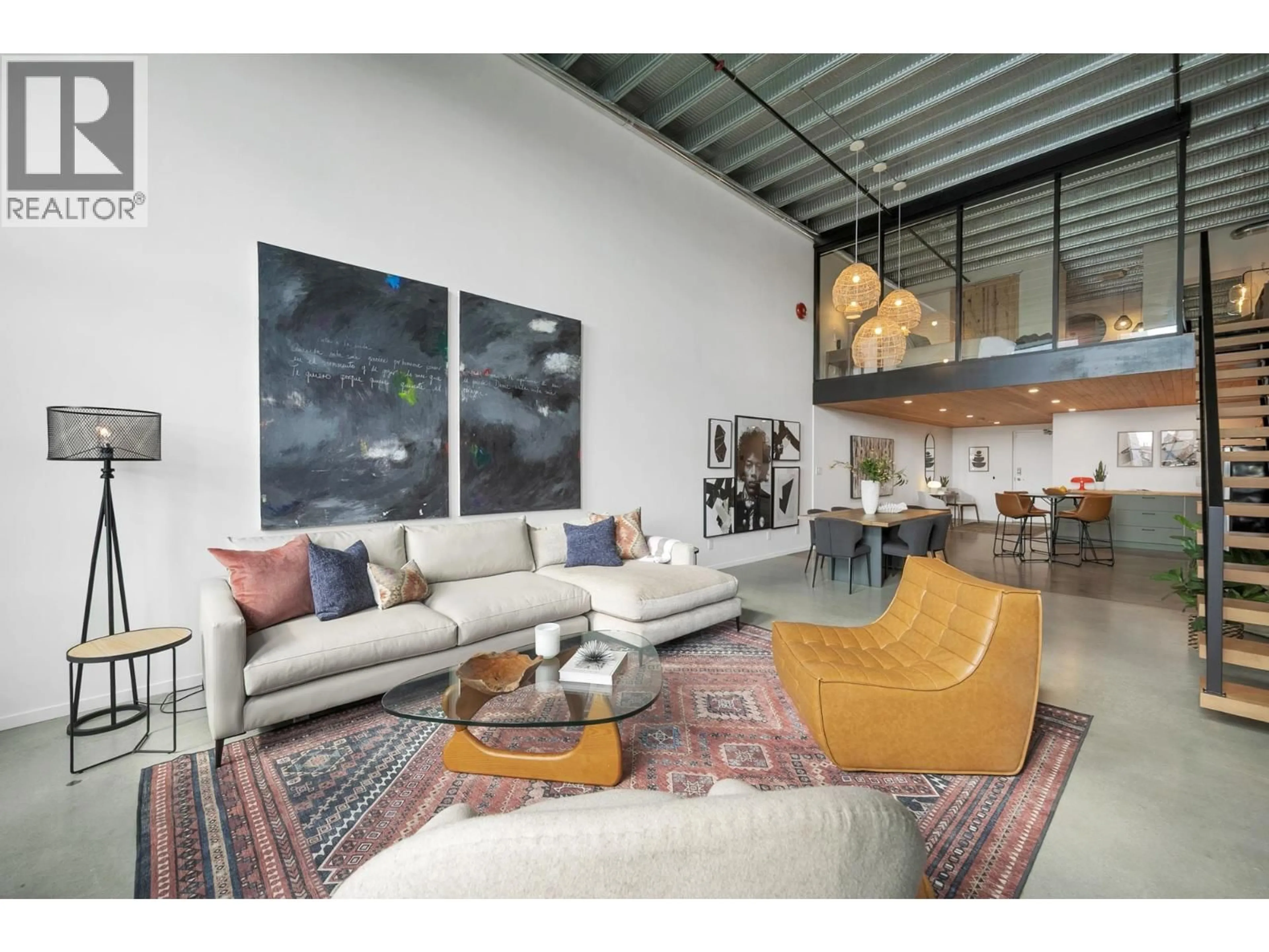 Living room with furniture, cement floor for 215 - 1220 PENDER STREET, Vancouver British Columbia V6A1W8