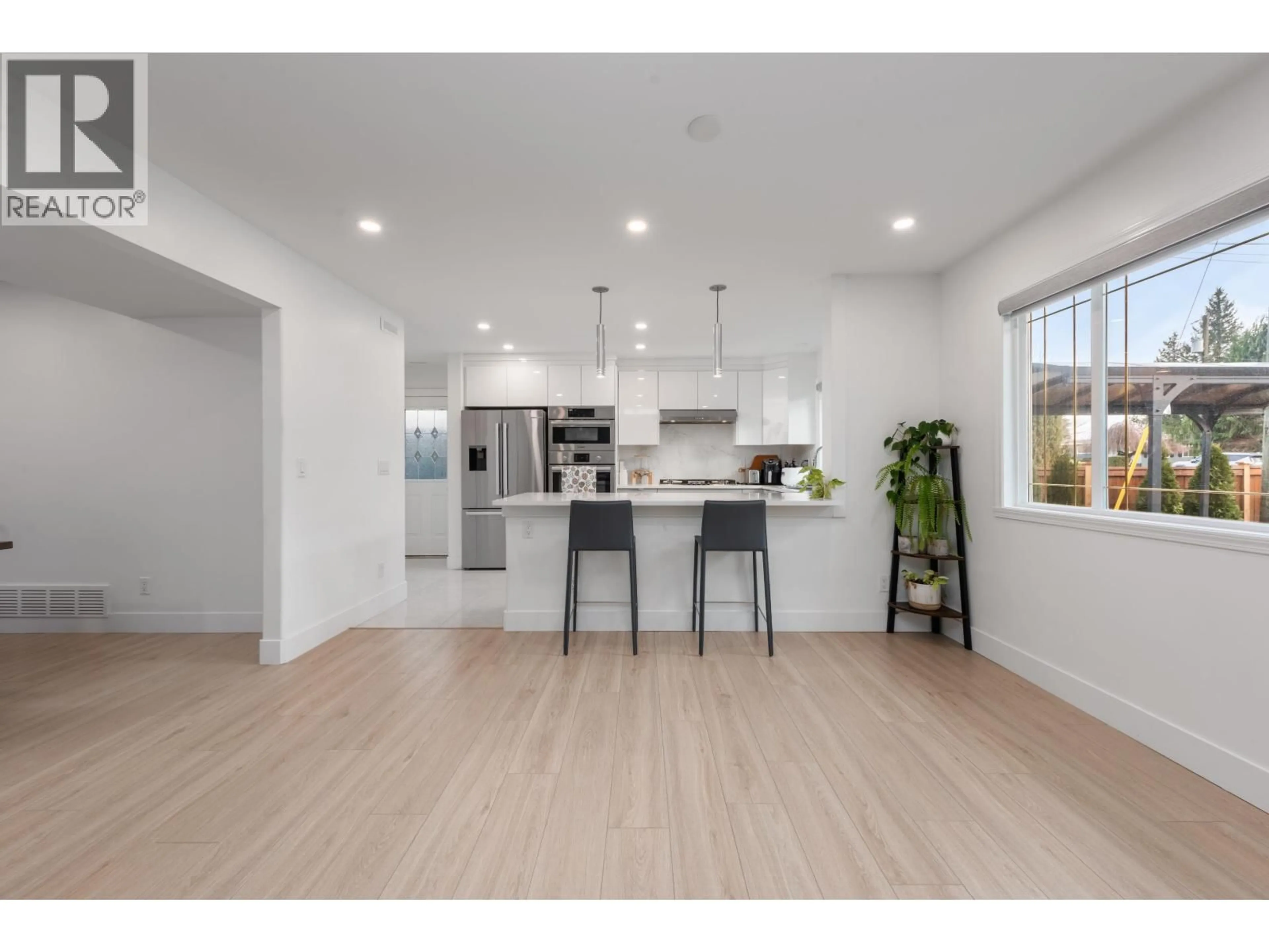 Open concept kitchen, wood/laminate floor for 103 - 1334 CHARLAND AVENUE, Coquitlam British Columbia V3K3L3