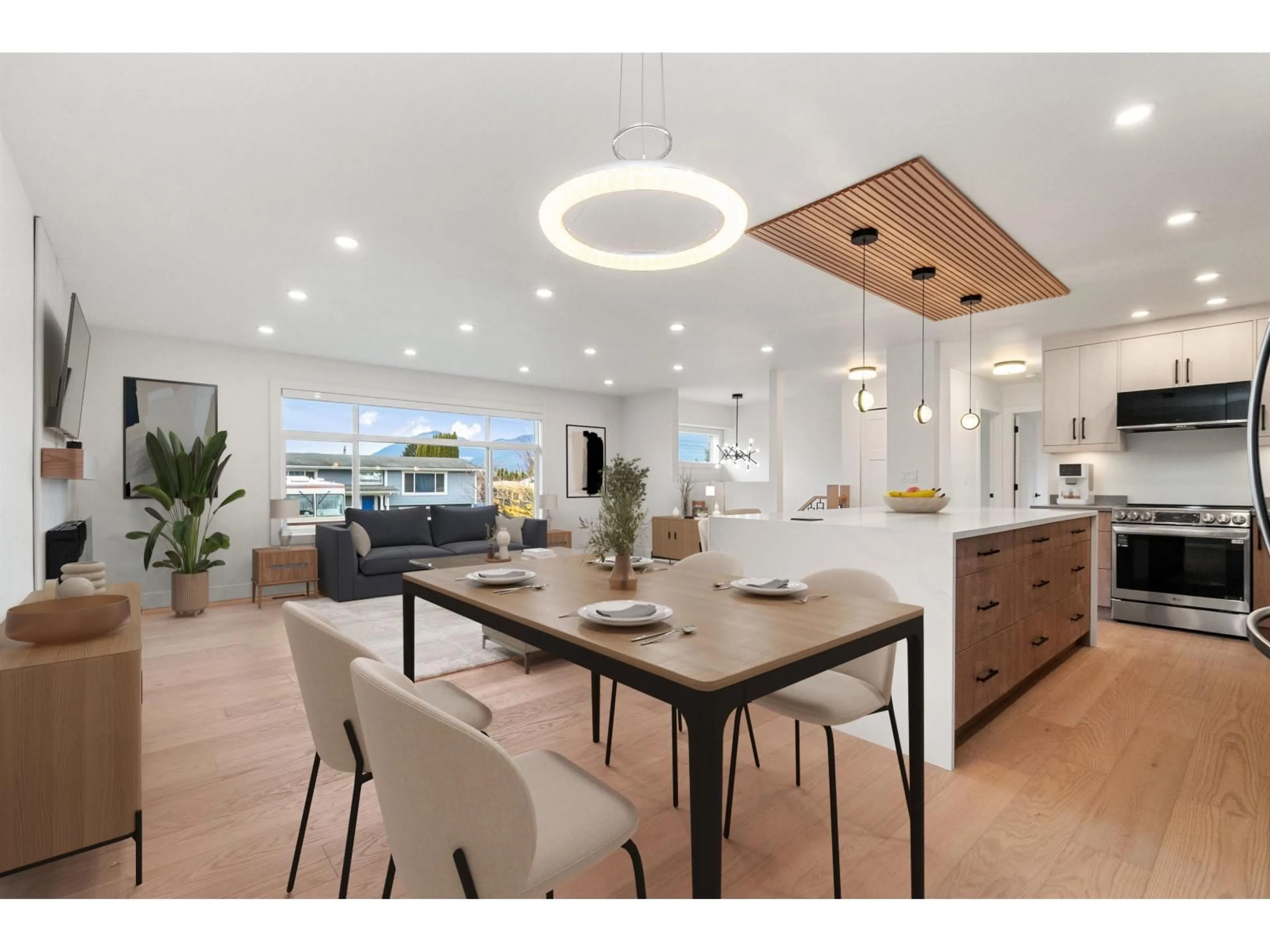 Open concept kitchen, wood/laminate floor for 8762 BUTCHART STREET, Chilliwack British Columbia V2P5S3