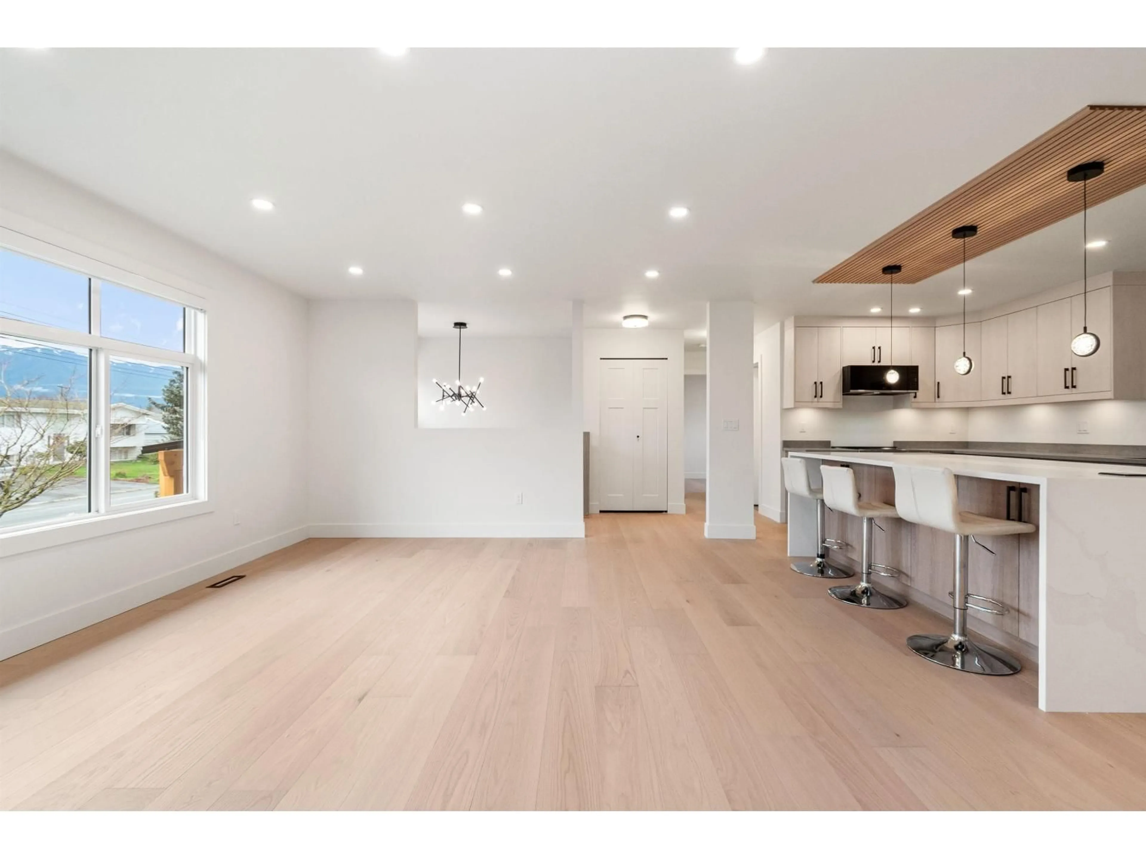 Open concept kitchen, wood/laminate floor for 8762 BUTCHART STREET, Chilliwack British Columbia V2P5S3