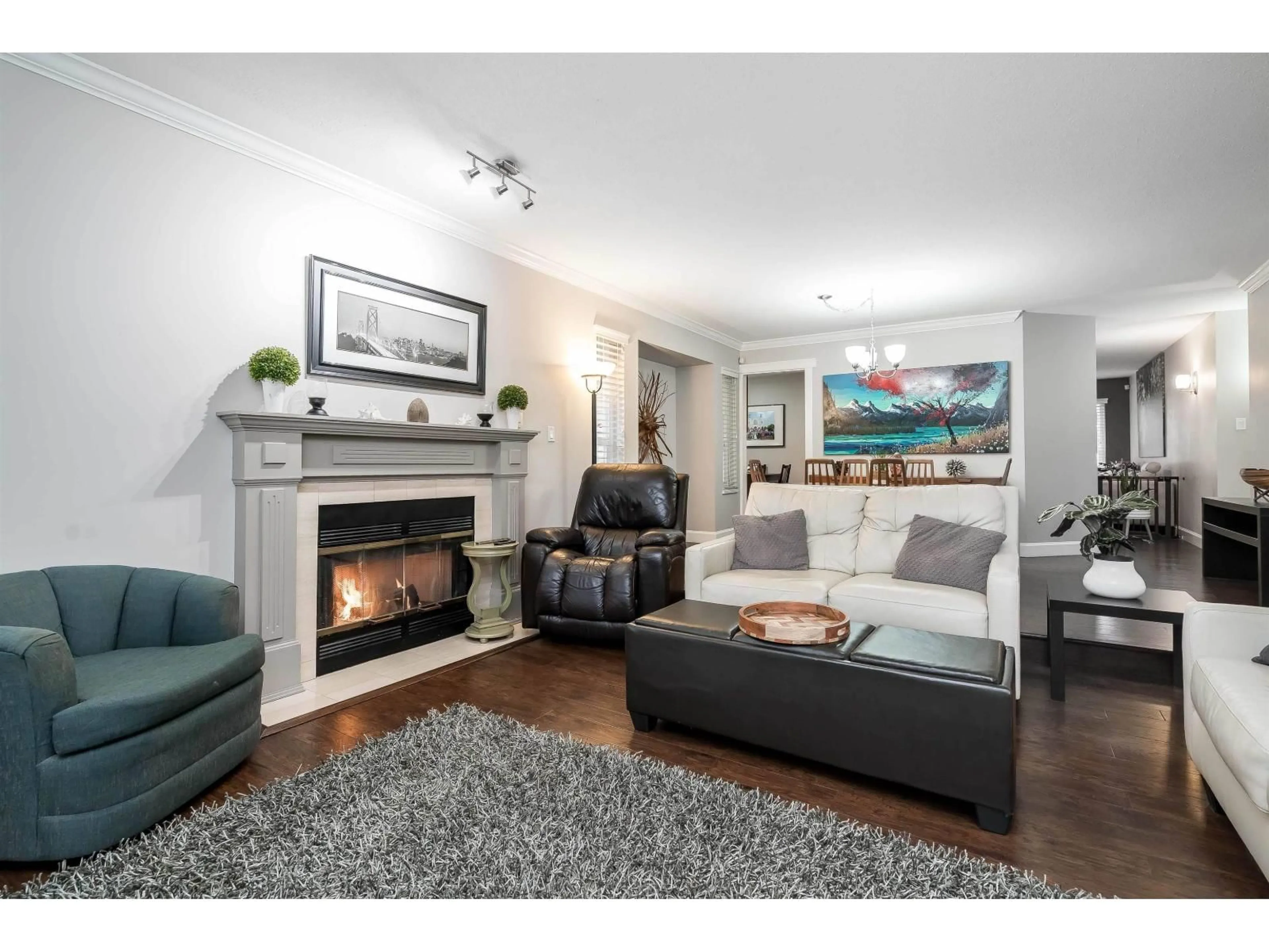 Living room with furniture, wood/laminate floor for 14086 17 AVENUE, Surrey British Columbia V4A8K4