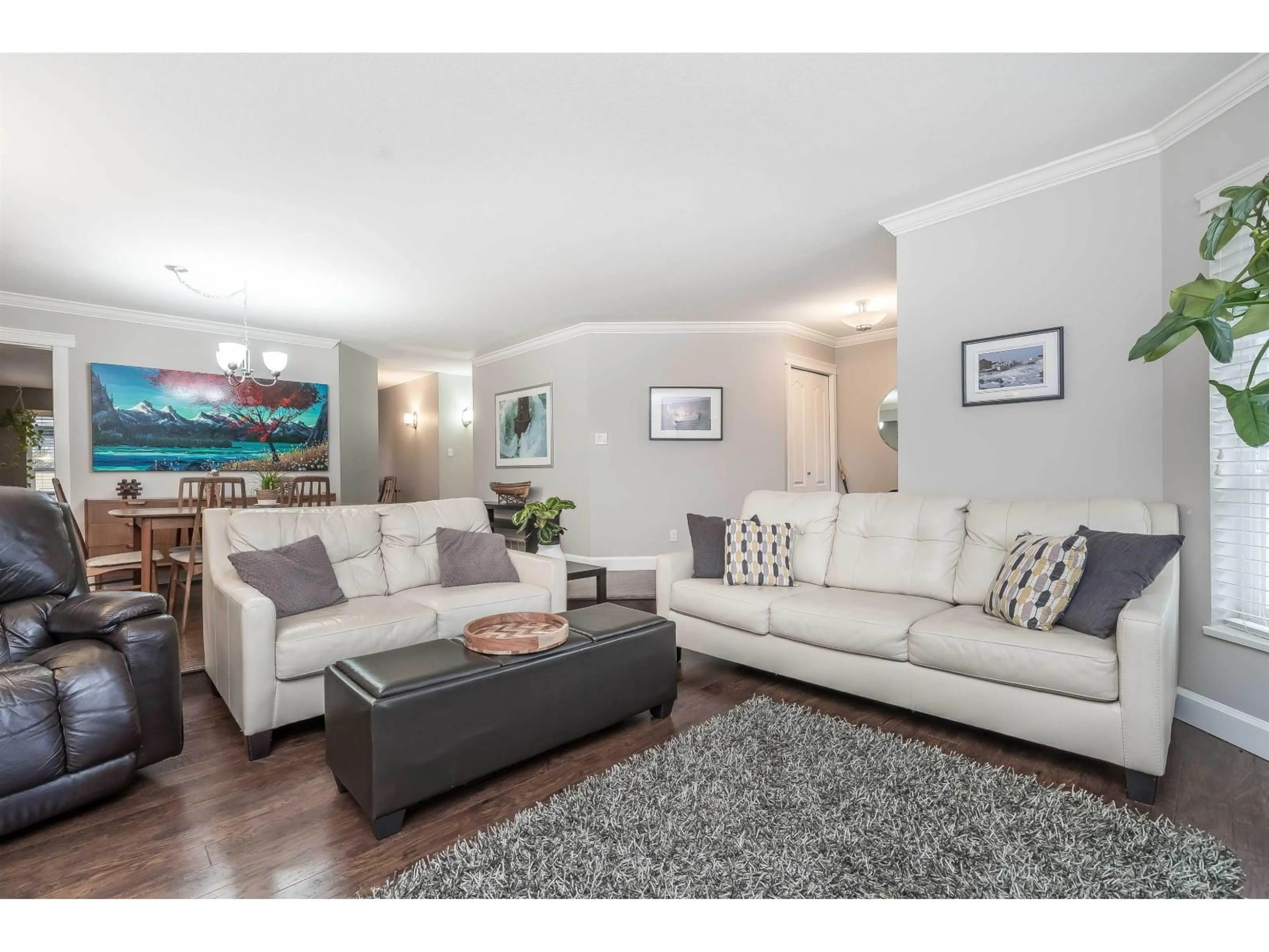 Living room with furniture, wood/laminate floor for 14086 17 AVENUE, Surrey British Columbia V4A8K4