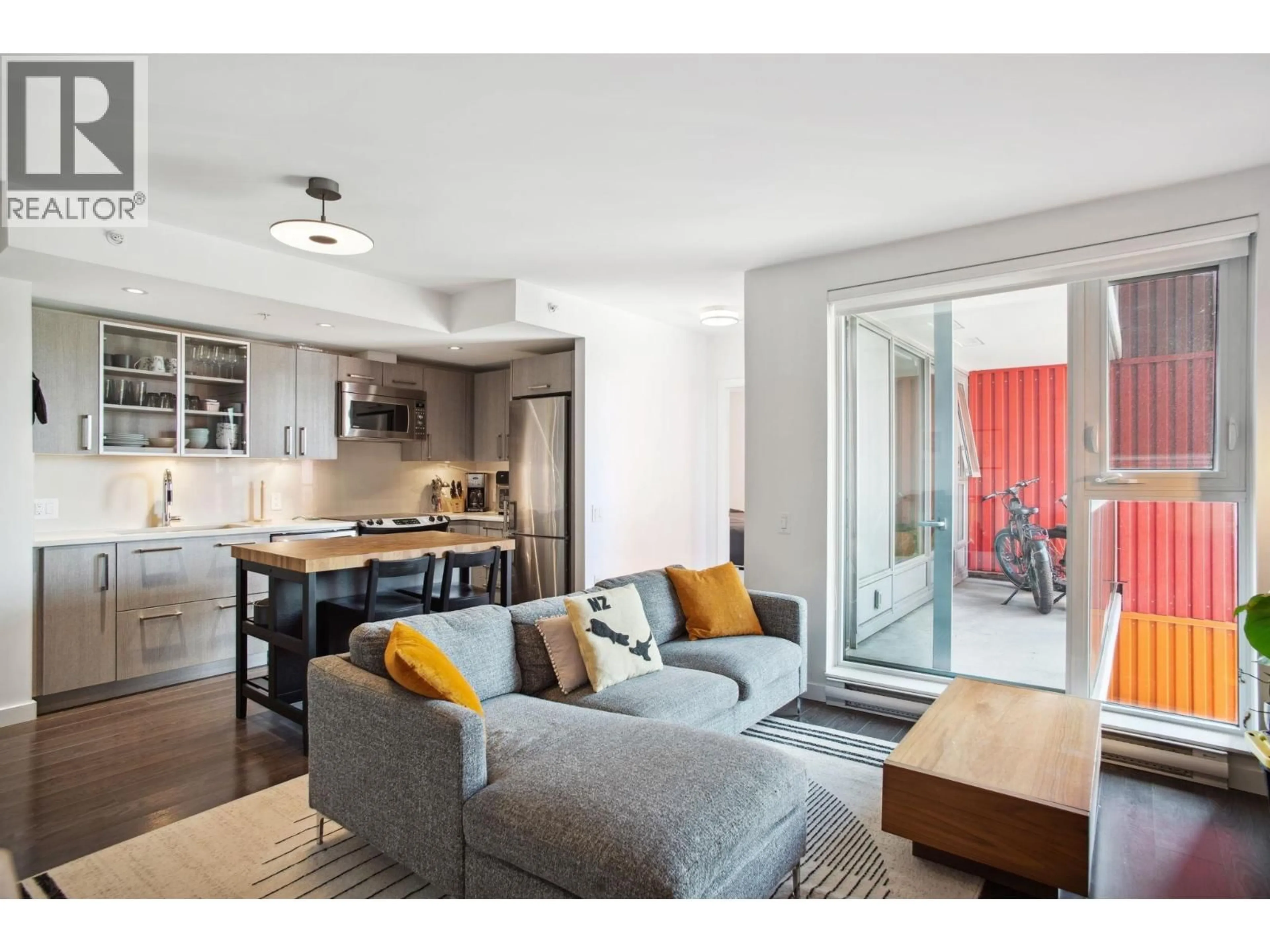 Living room with furniture, wood/laminate floor for 501 - 983 HASTINGS STREET, Vancouver British Columbia V6A0G9