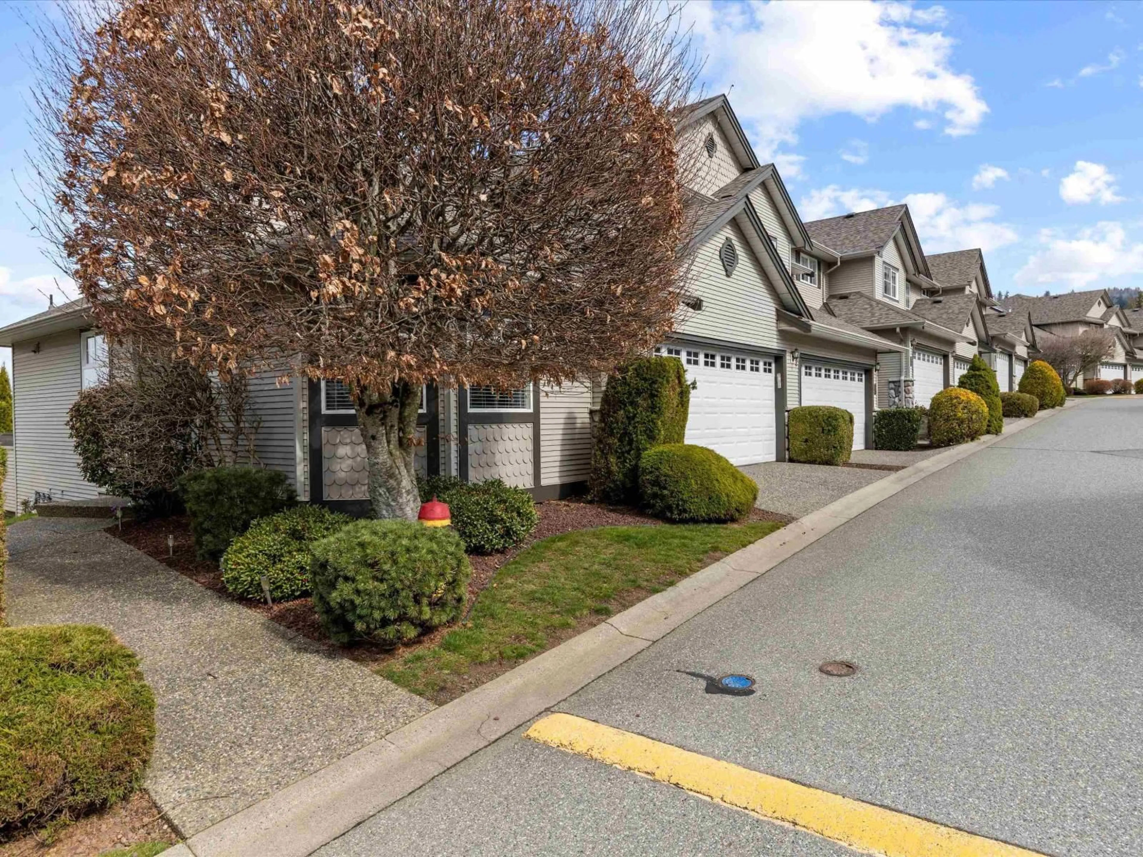 A pic from outside/outdoor area/front of a property/back of a property/a pic from drone, street for 56 - 46360 VALLEYVIEW ROAD, Chilliwack British Columbia V2R5L7