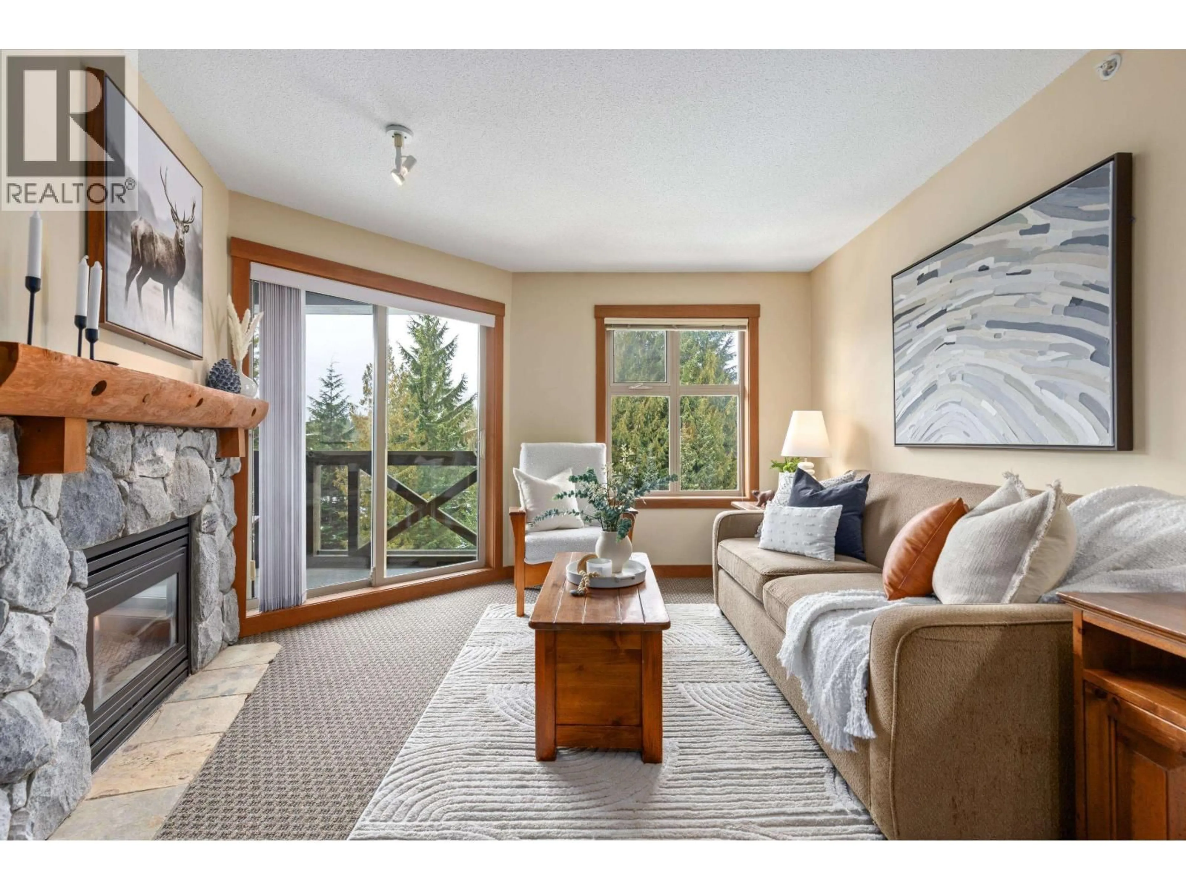 Living room with furniture, wood/laminate floor for 511 - 4660 BLACKCOMB WAY, Whistler British Columbia V0N1B4