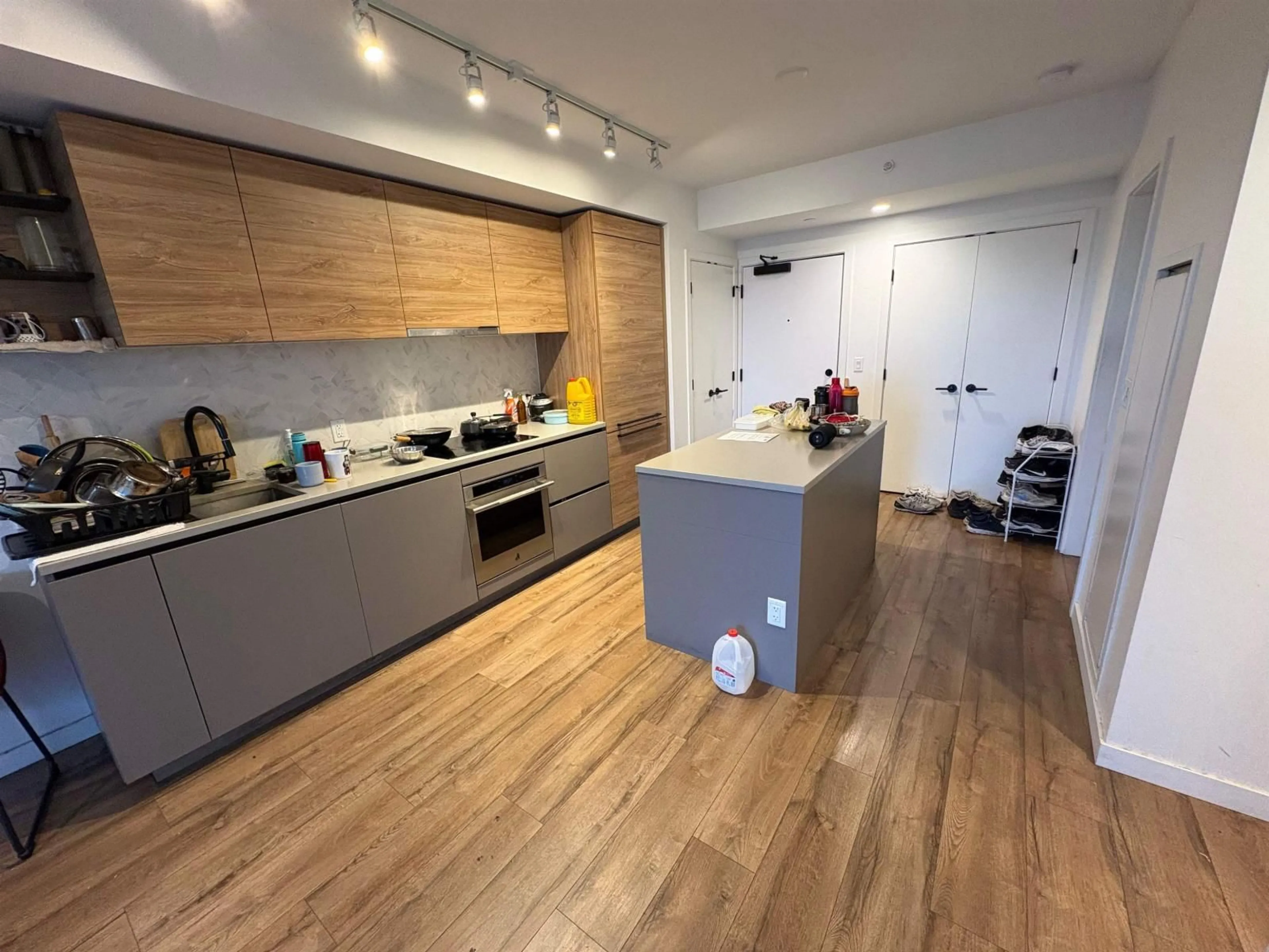 Open concept kitchen, wood/laminate floor for 1901 - 13428 105 AVENUE, Surrey British Columbia V3T0S6