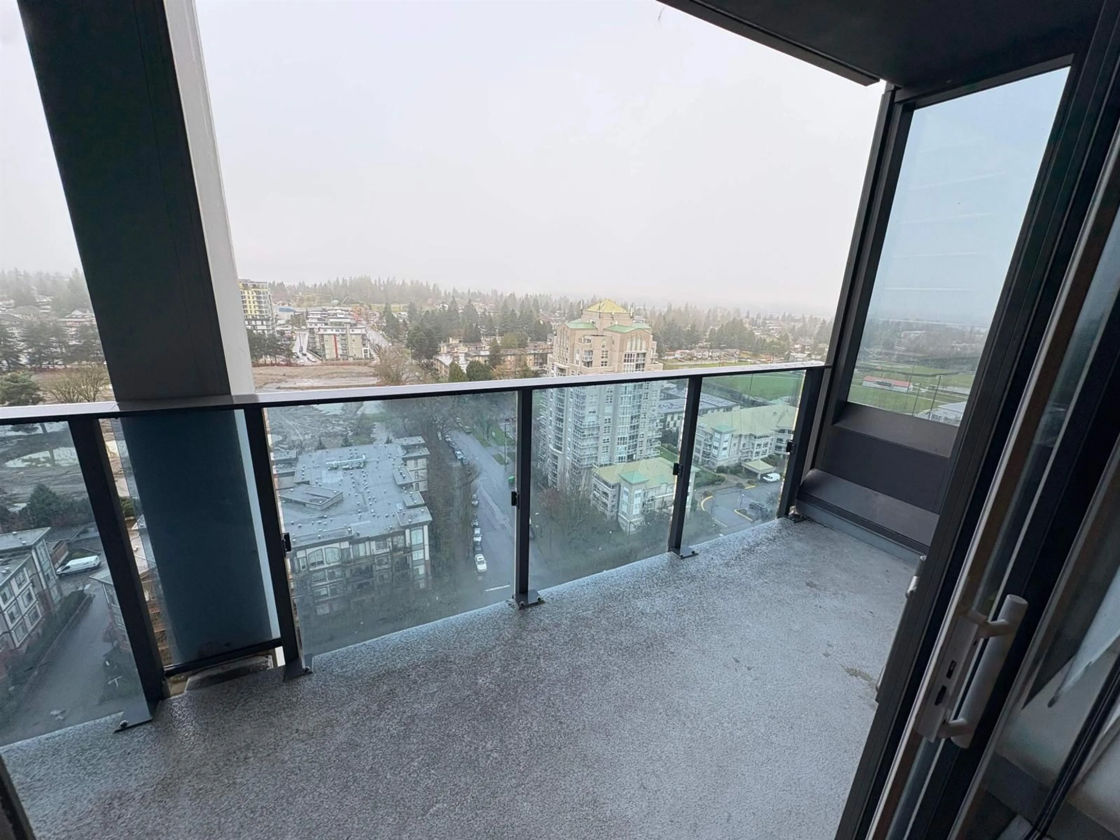 Balcony in the apartment, city buildings view from balcony for 1901 - 13428 105 AVENUE, Surrey British Columbia V3T0S6